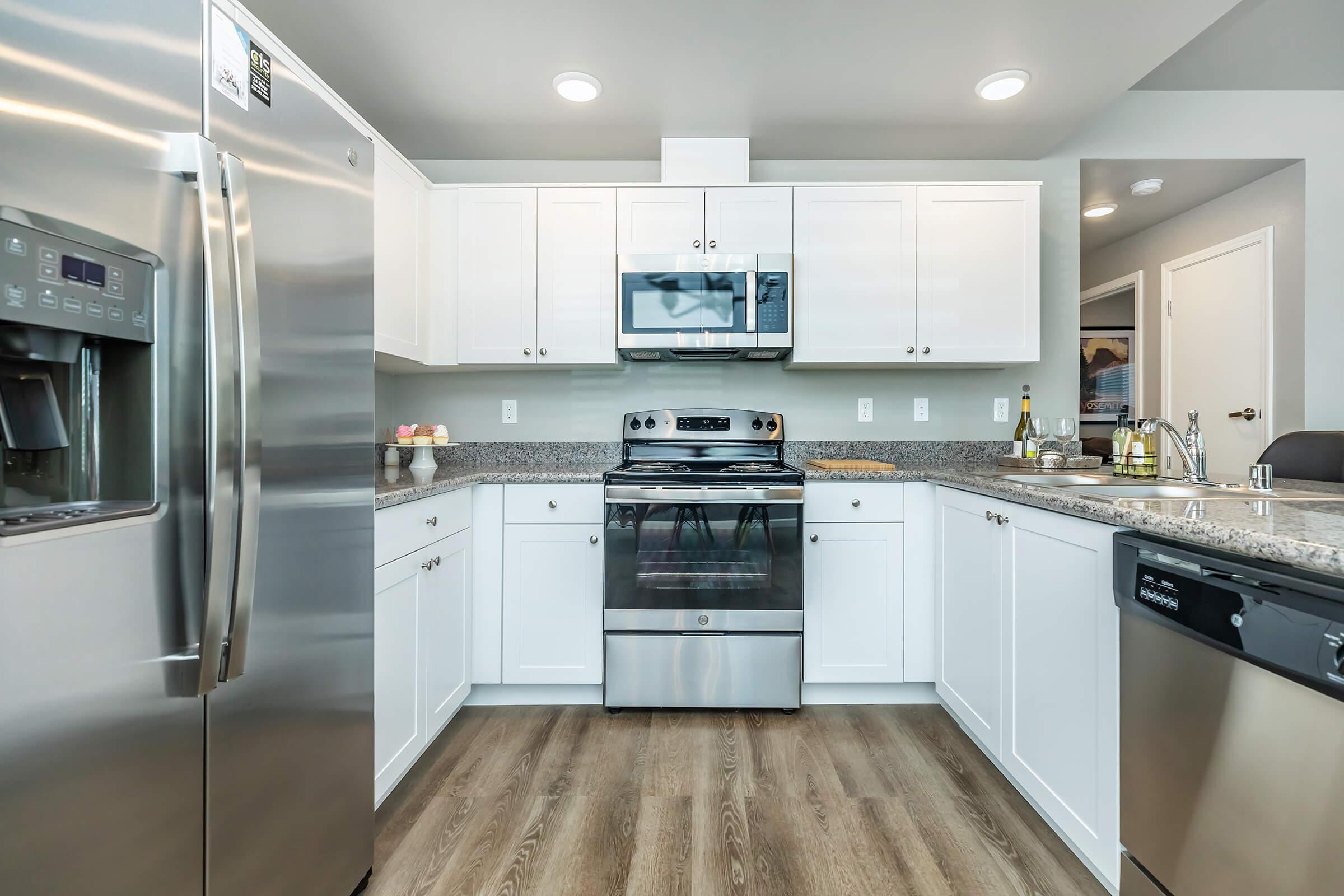 a large kitchen with stainless steel appliances