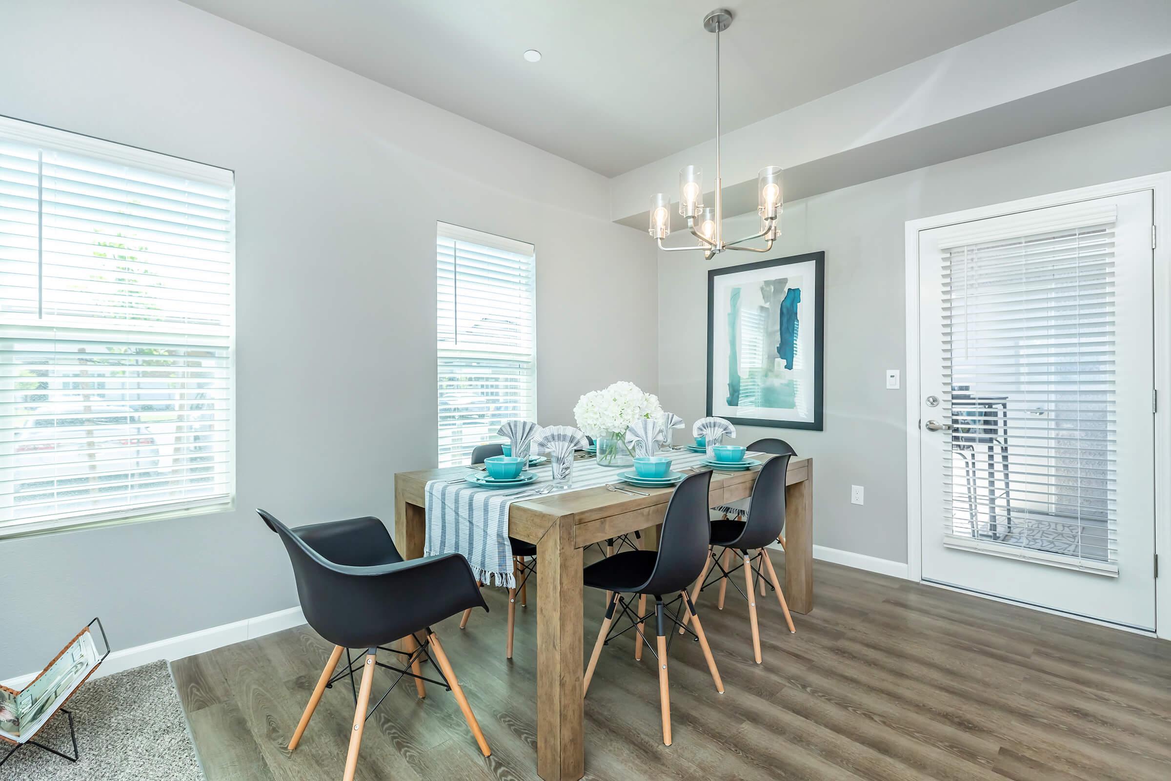 a living room filled with furniture and a large window