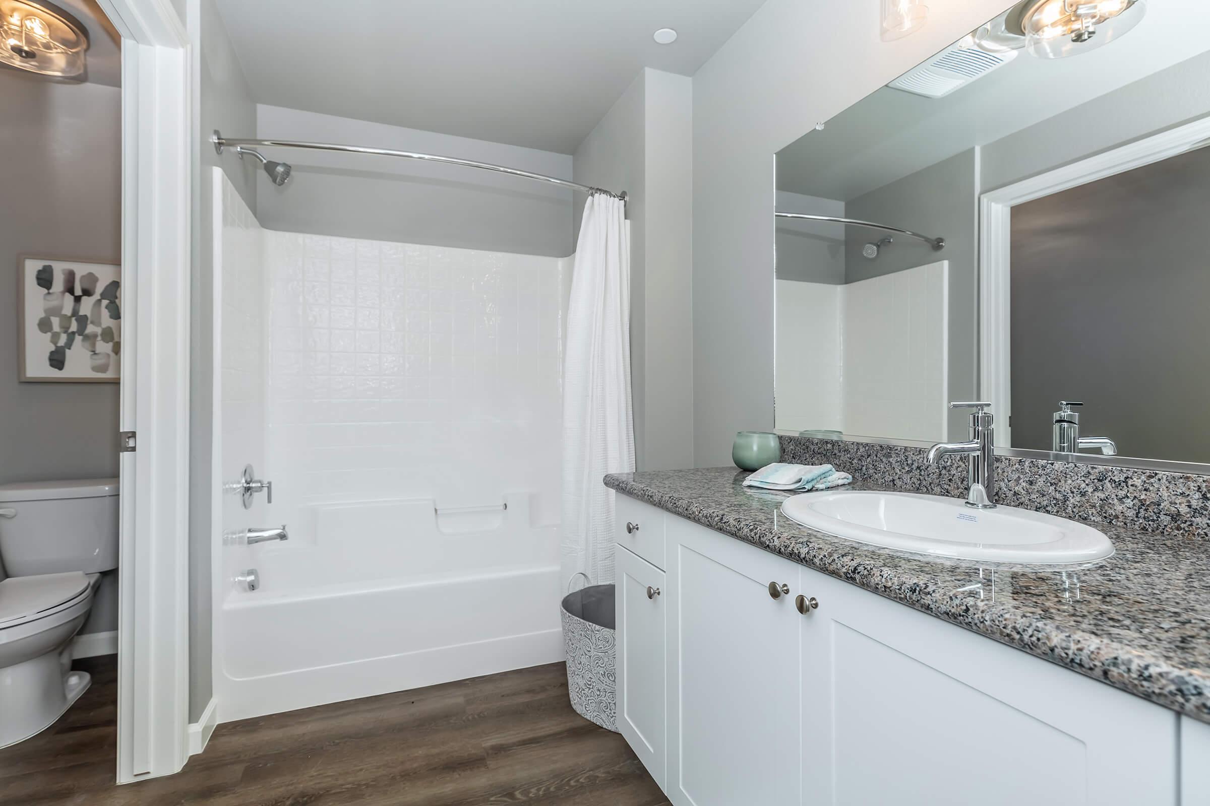 a kitchen with a sink and a mirror