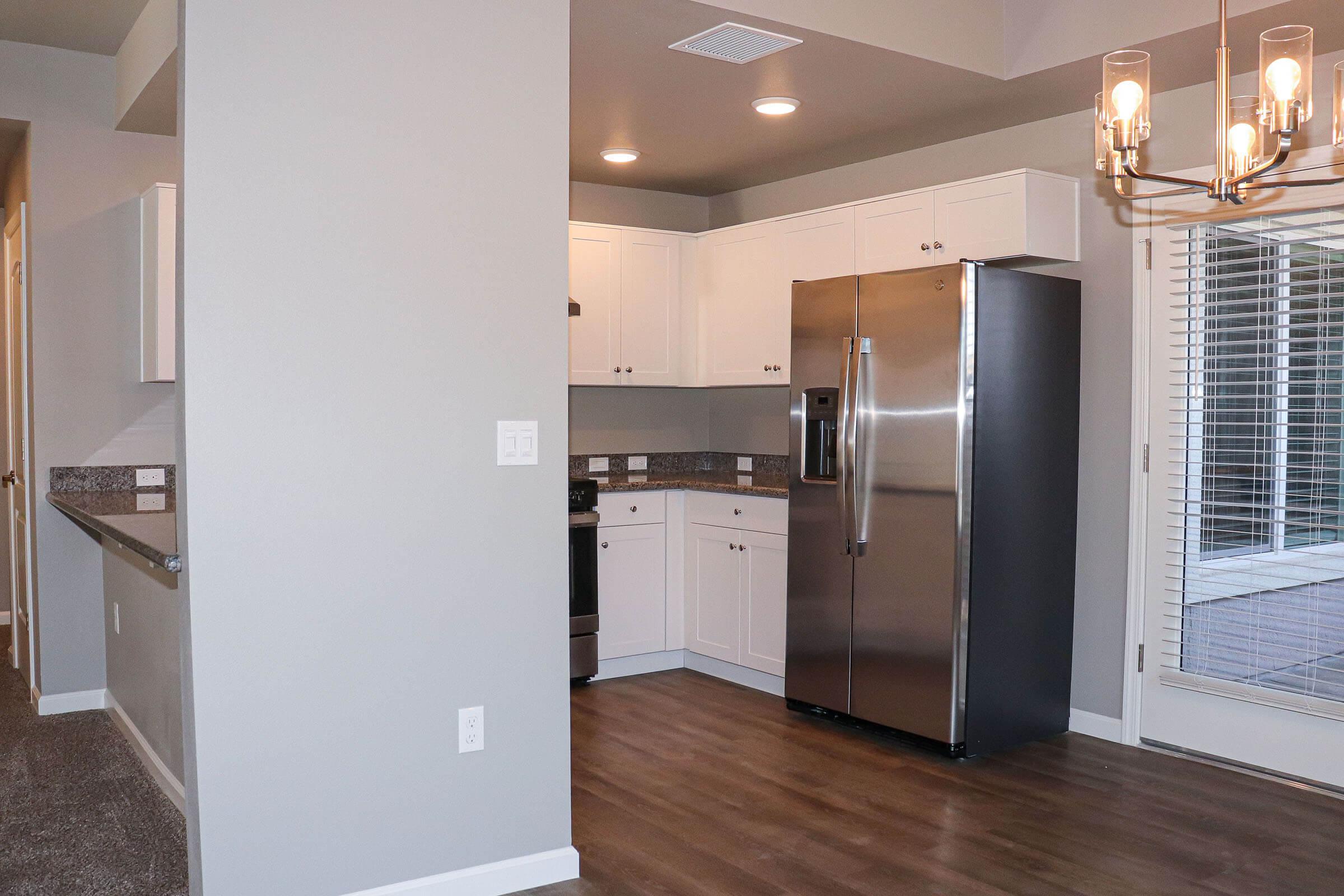 a stainless steel refrigerator in a kitchen