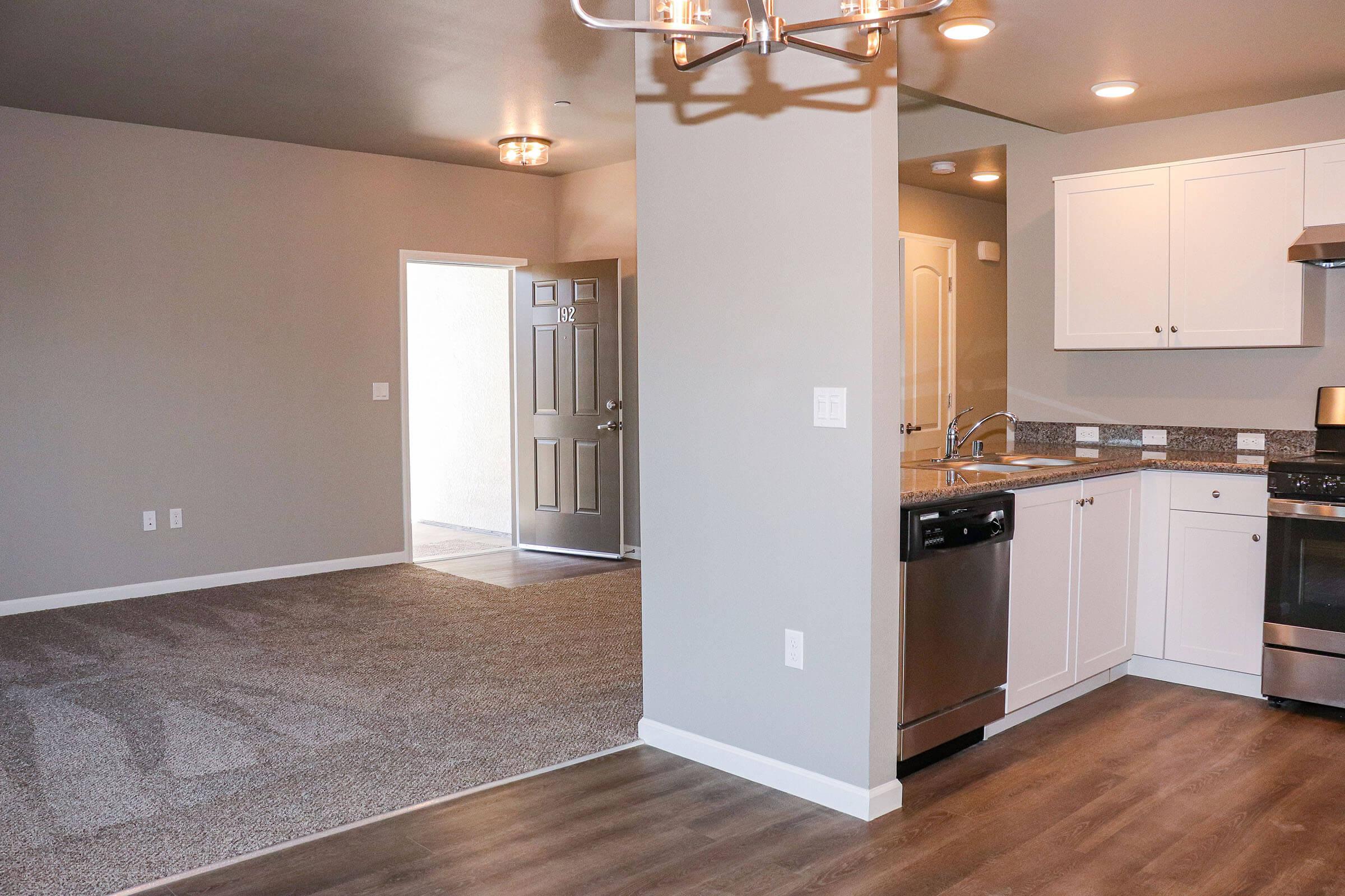 a kitchen with a wood floor