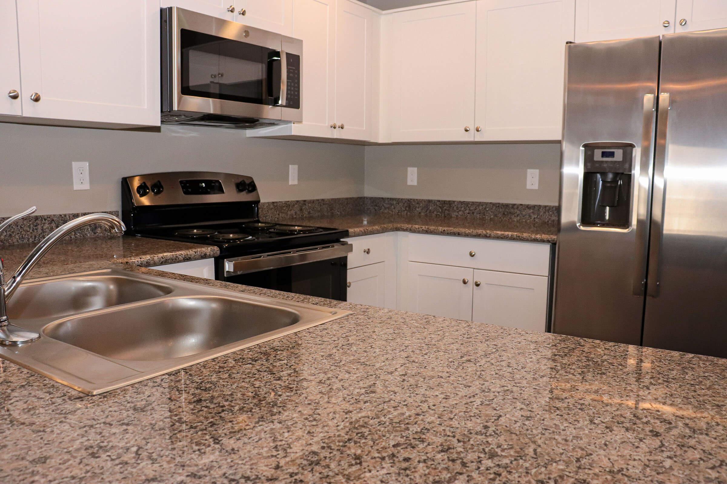 a kitchen with stainless steel appliances