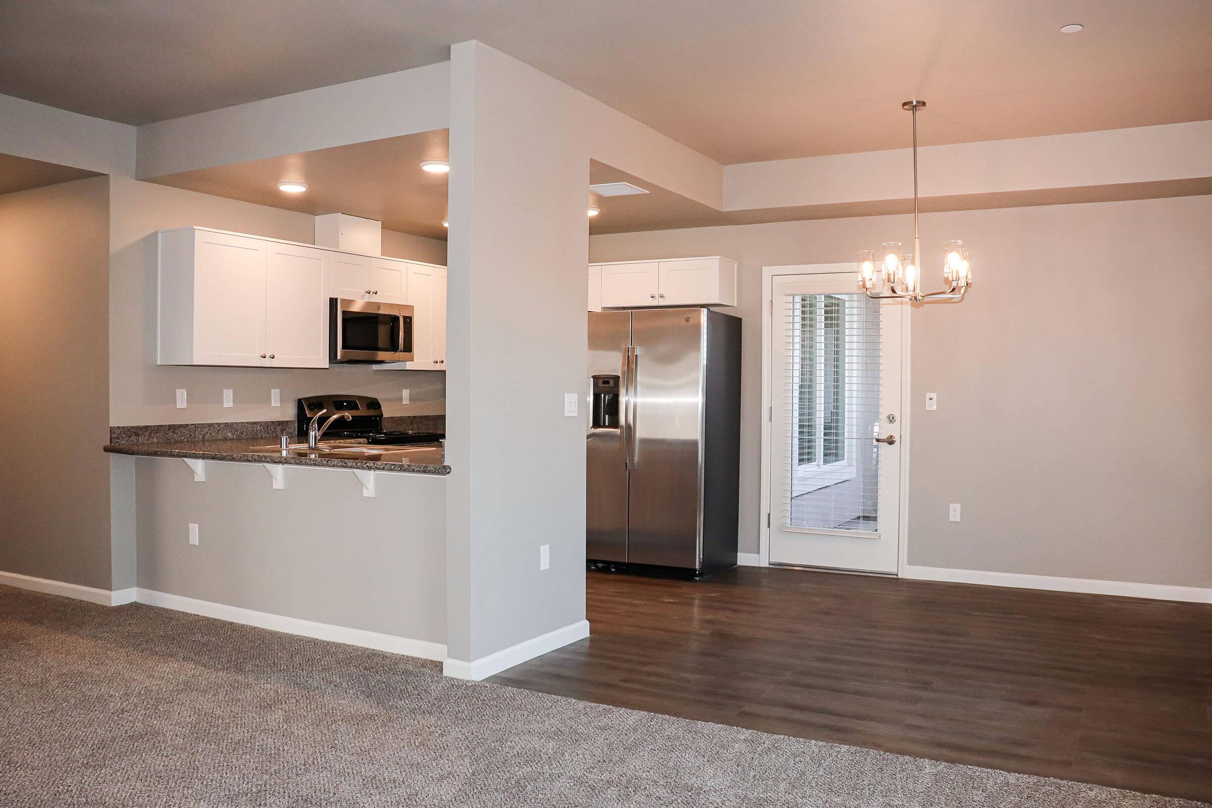 a kitchen with a large mirror