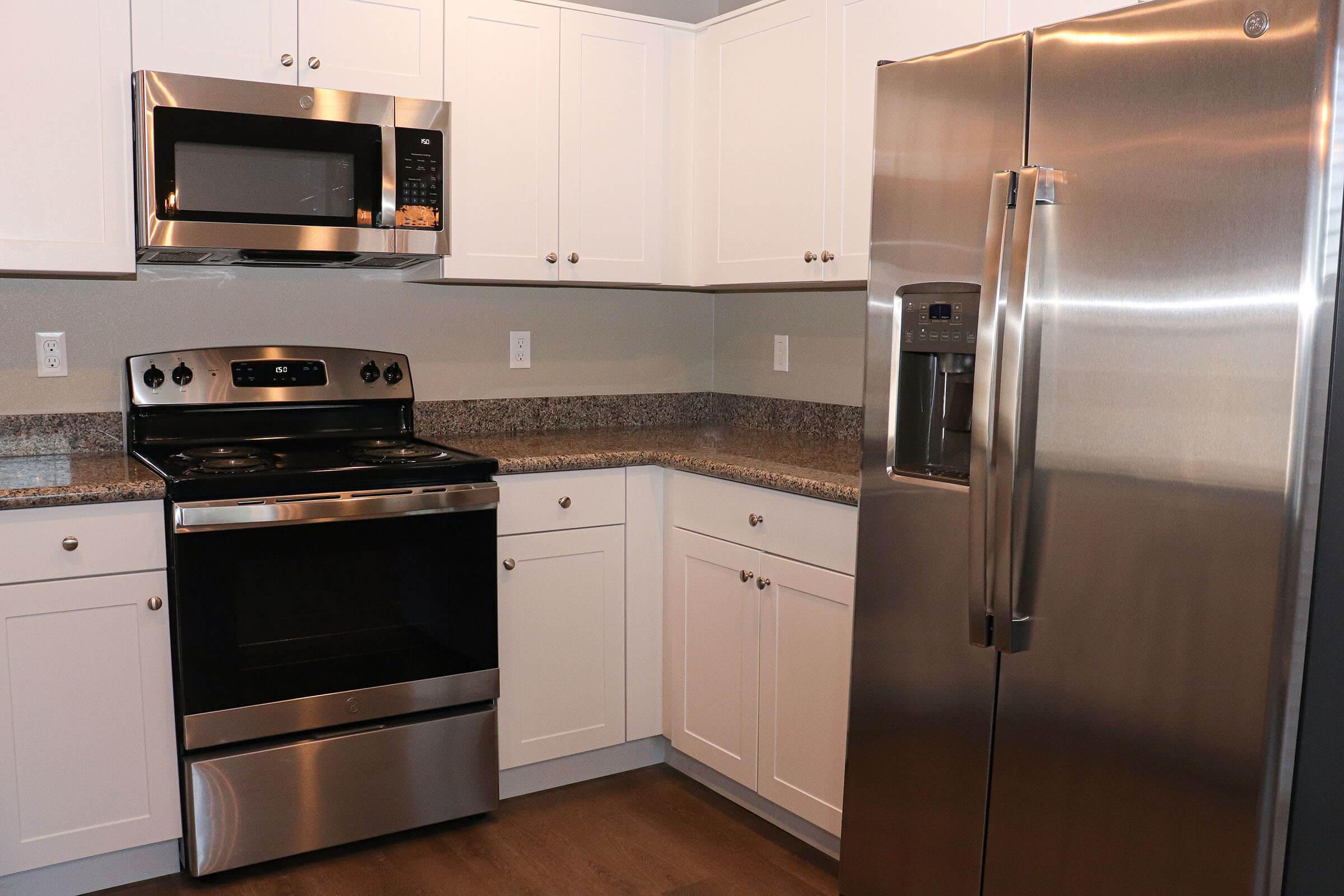 a kitchen with a stove top oven sitting inside of a refrigerator