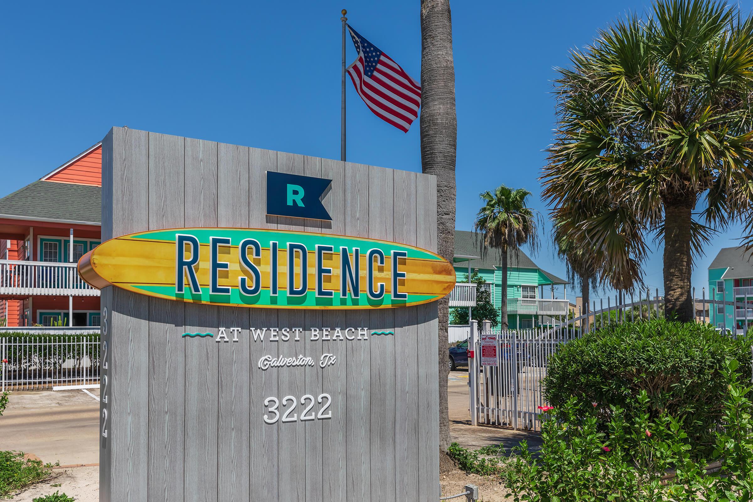 a sign in front of a building