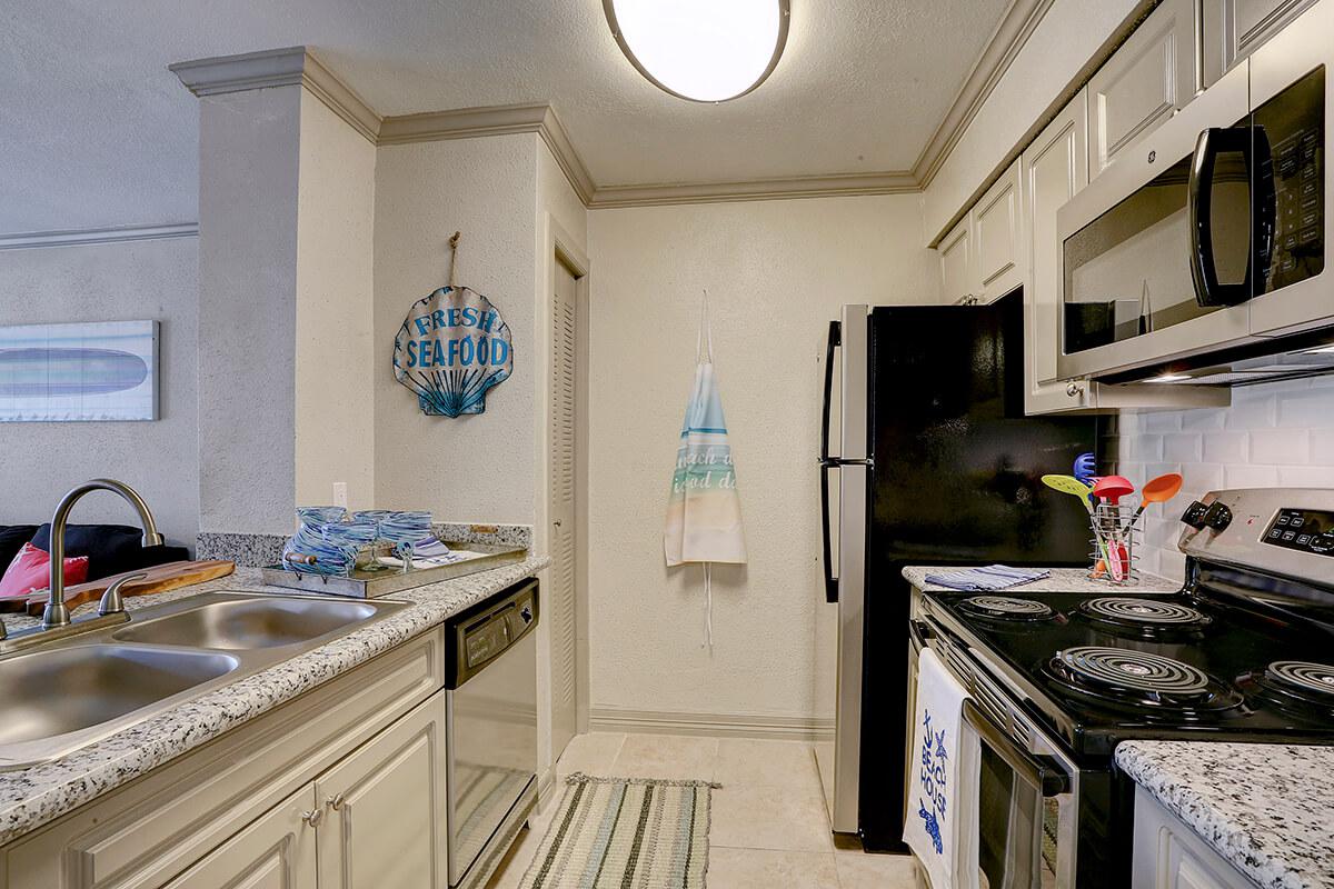 a kitchen with a stove and a sink