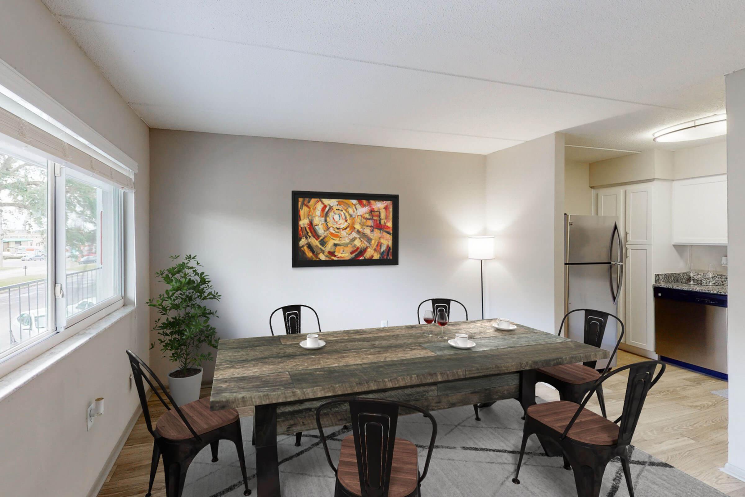 a room filled with furniture and a large window