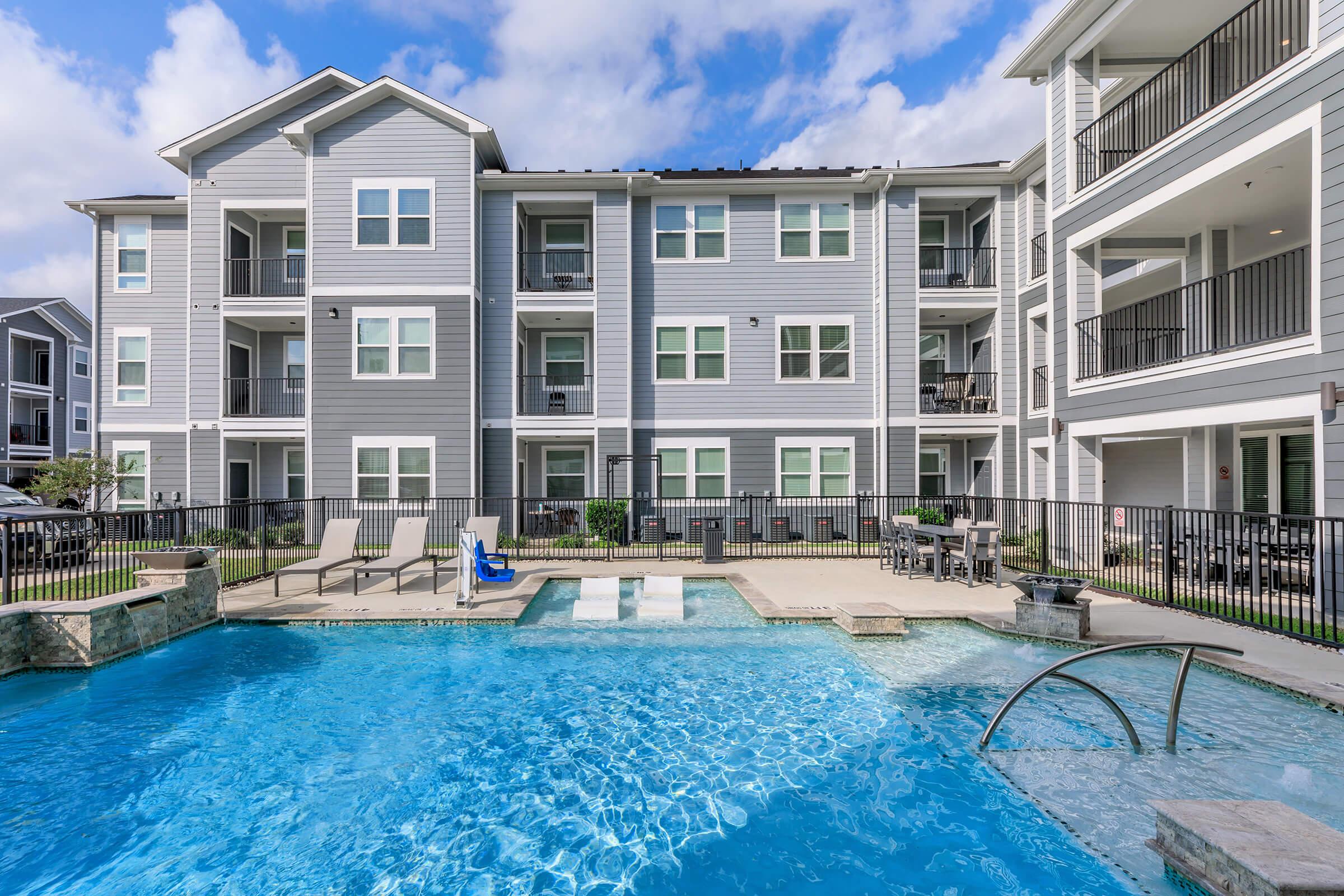 a large pool of water in front of a building