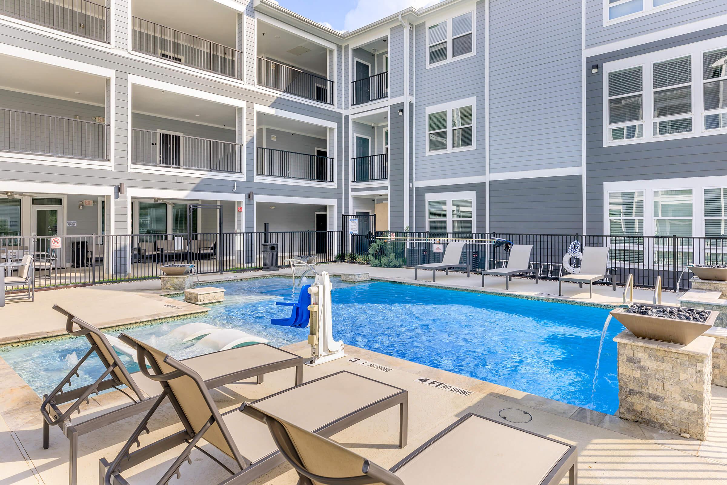 a pool in front of a building