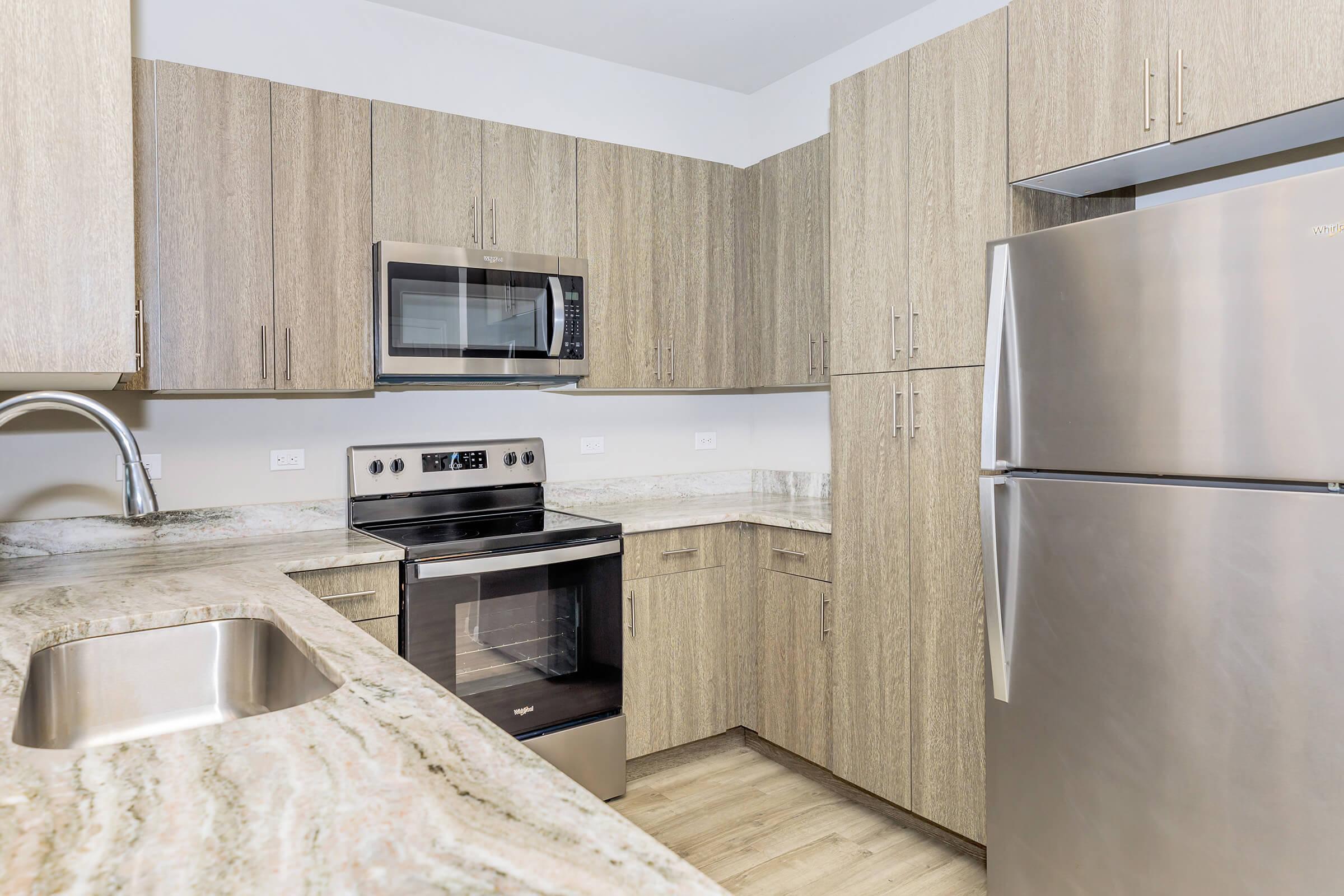 a kitchen with a sink and a refrigerator