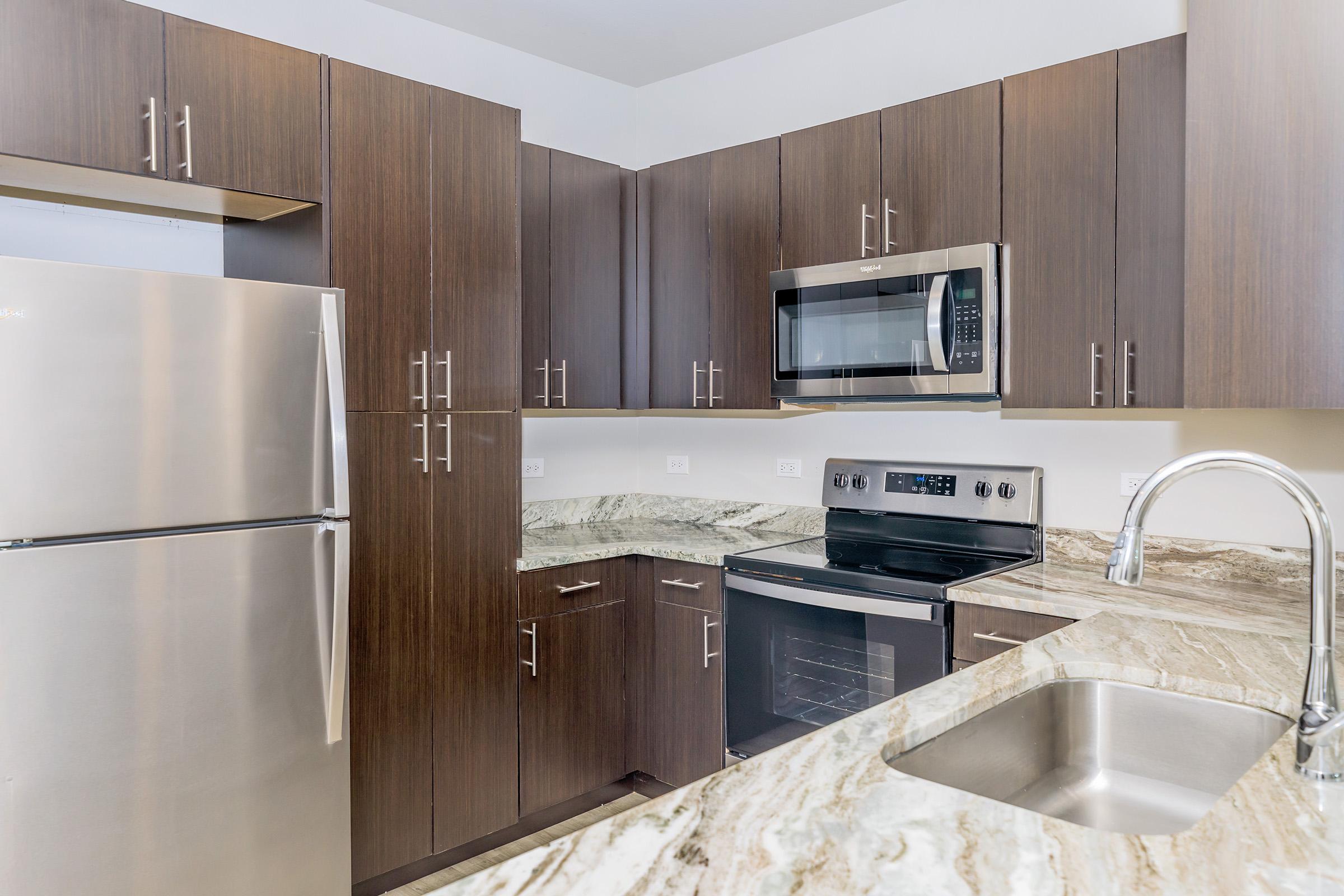 a large kitchen with stainless steel appliances