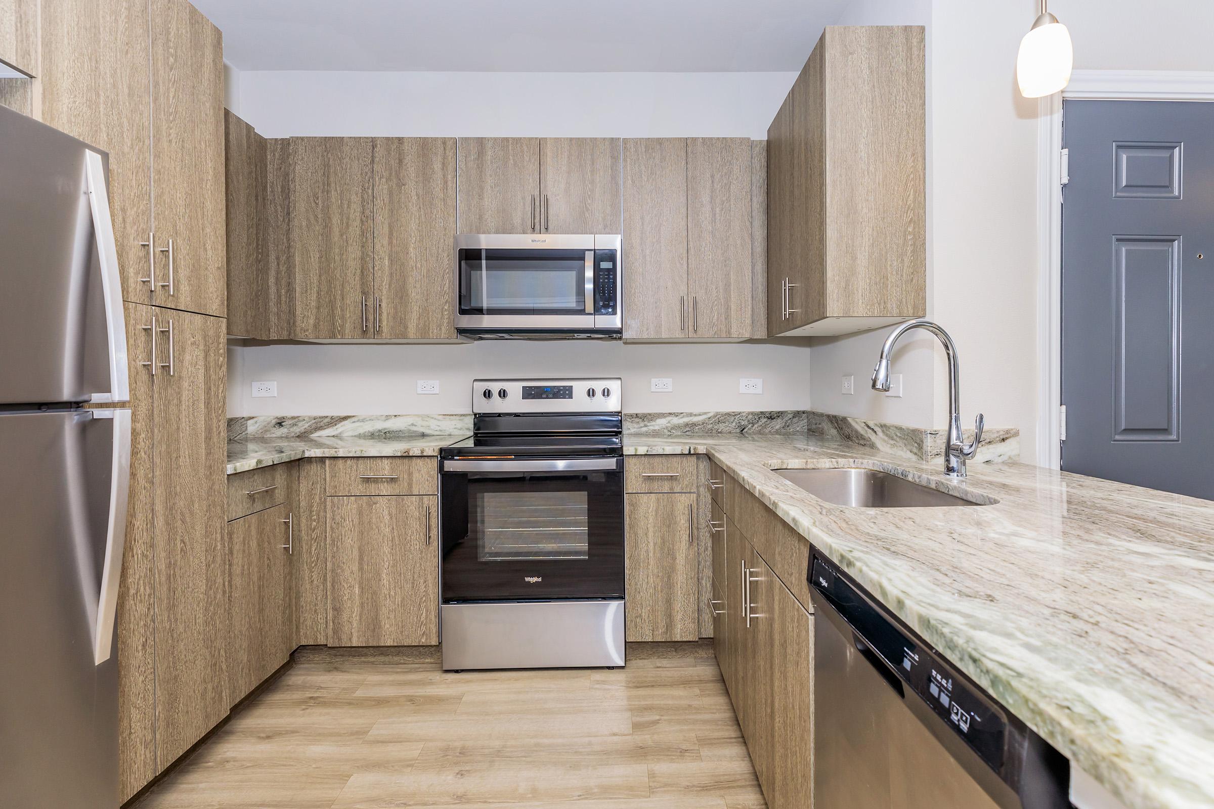 a stainless steel refrigerator in a kitchen