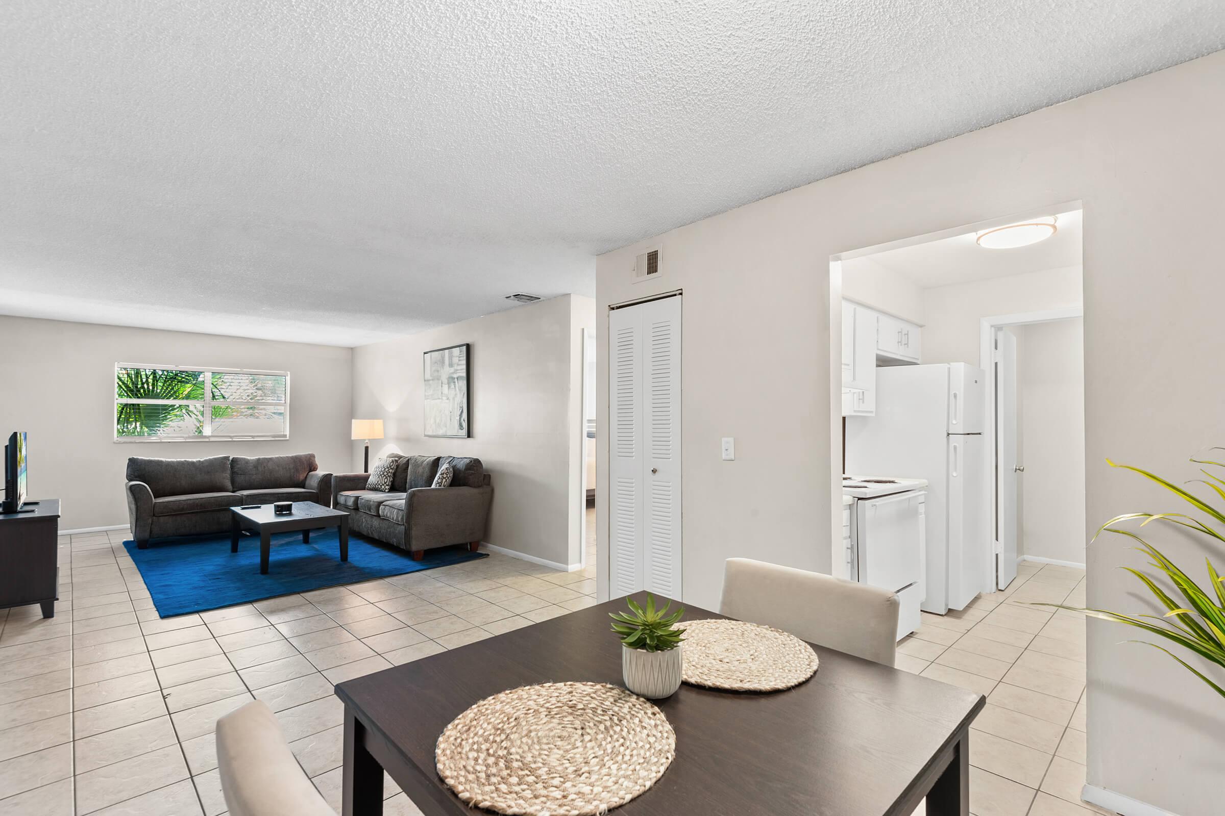 a room filled with furniture and a sink