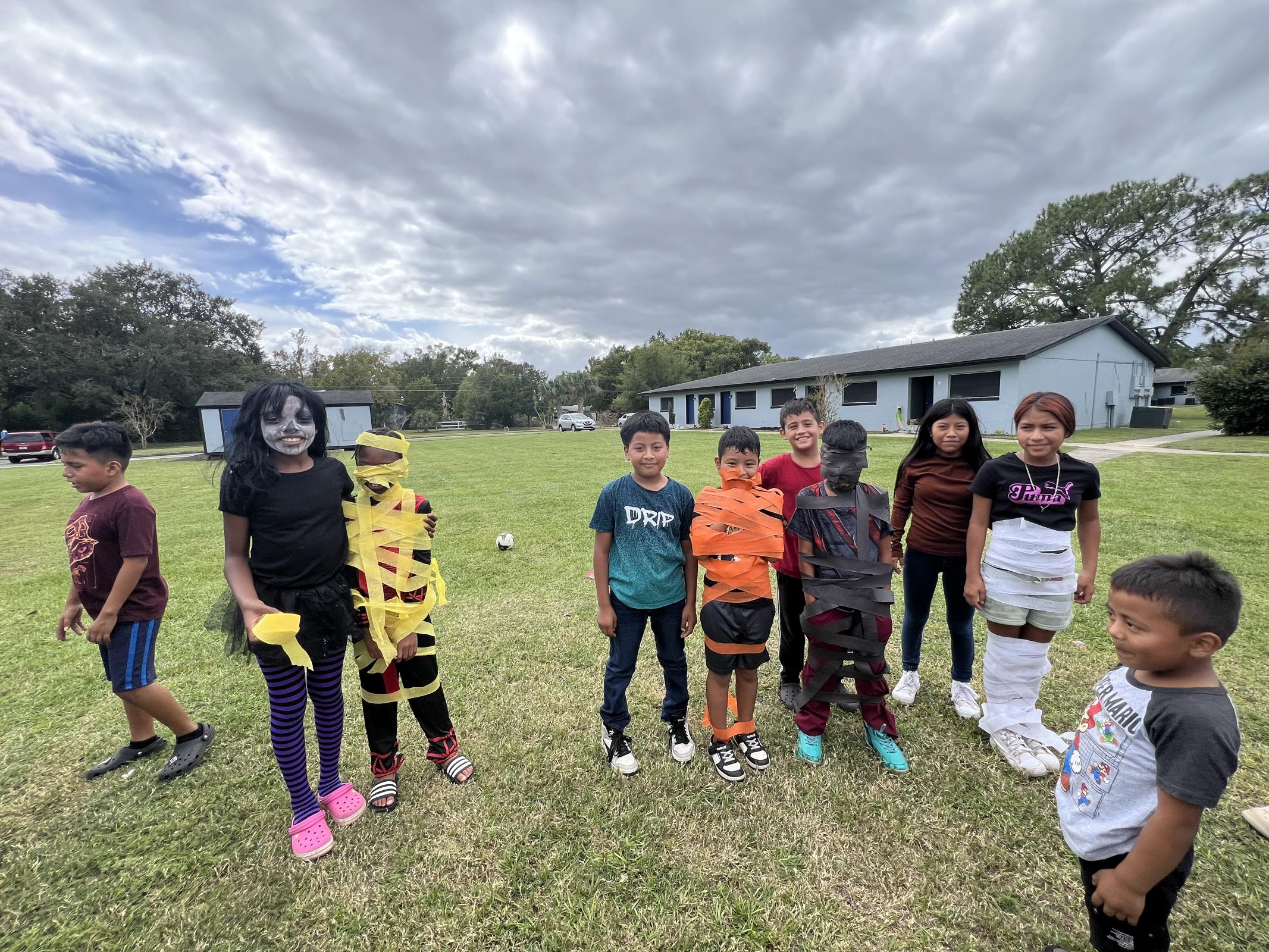 a group of people standing in a field