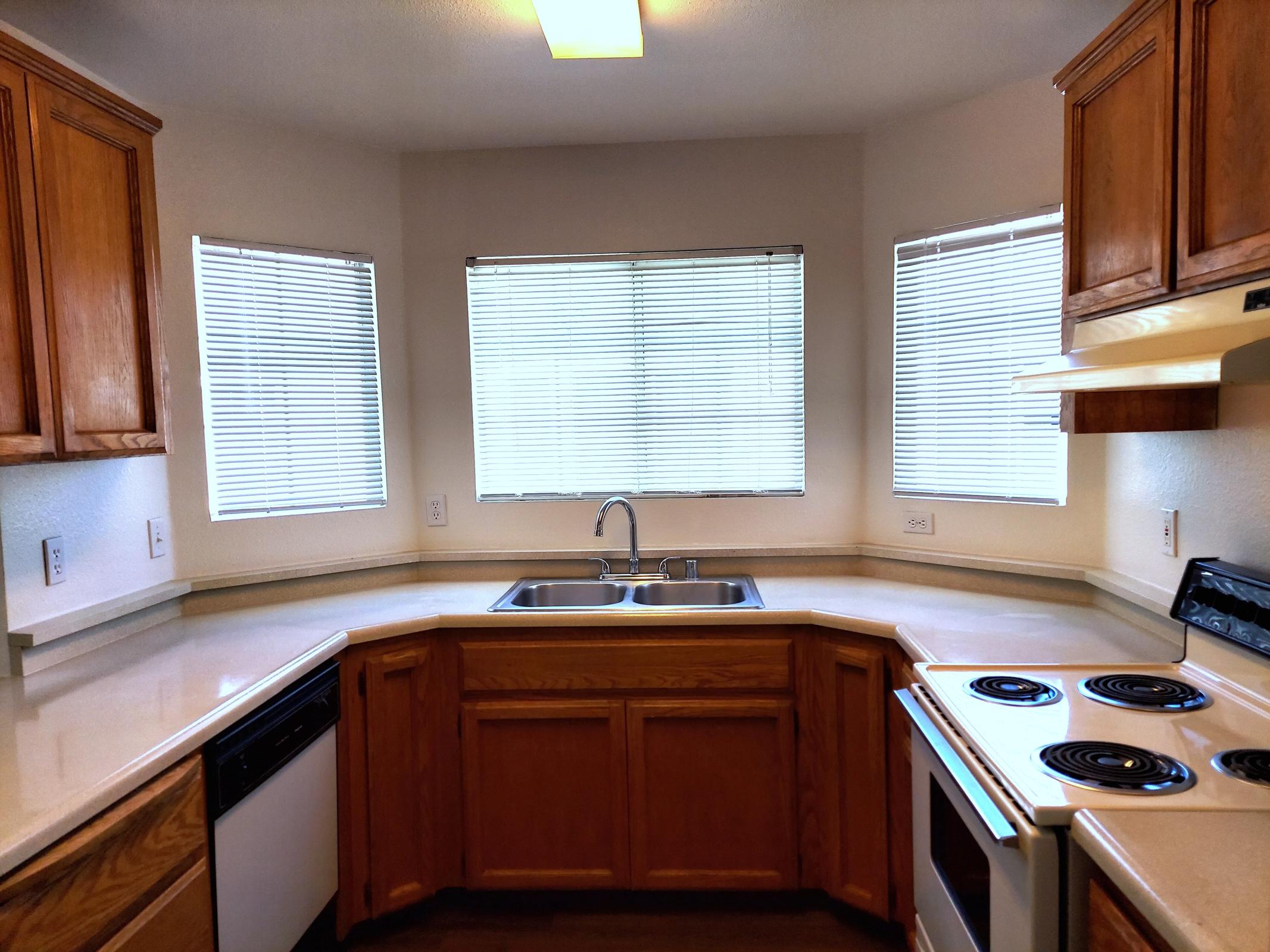 a kitchen with a stove top oven