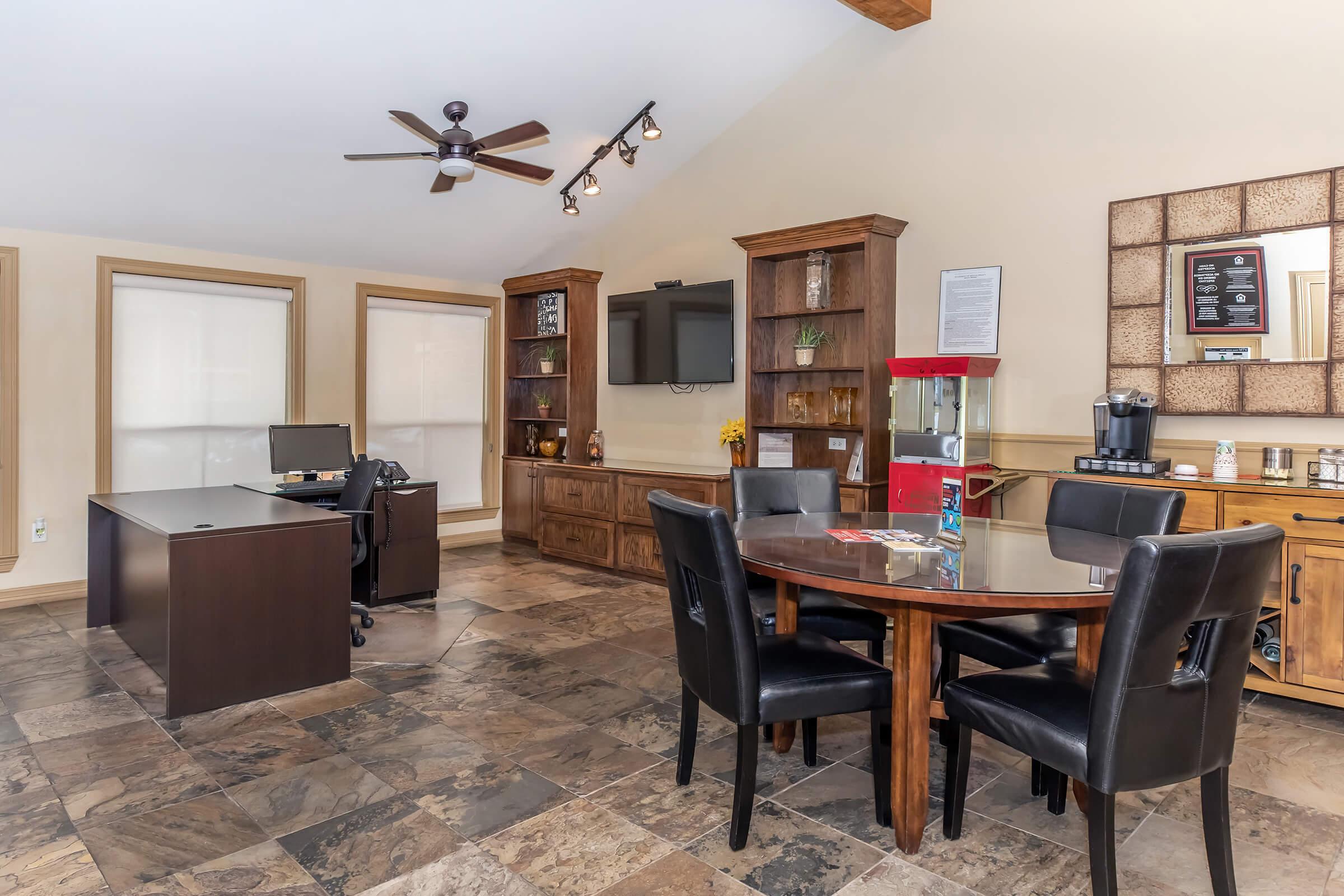 a living room filled with furniture and a table