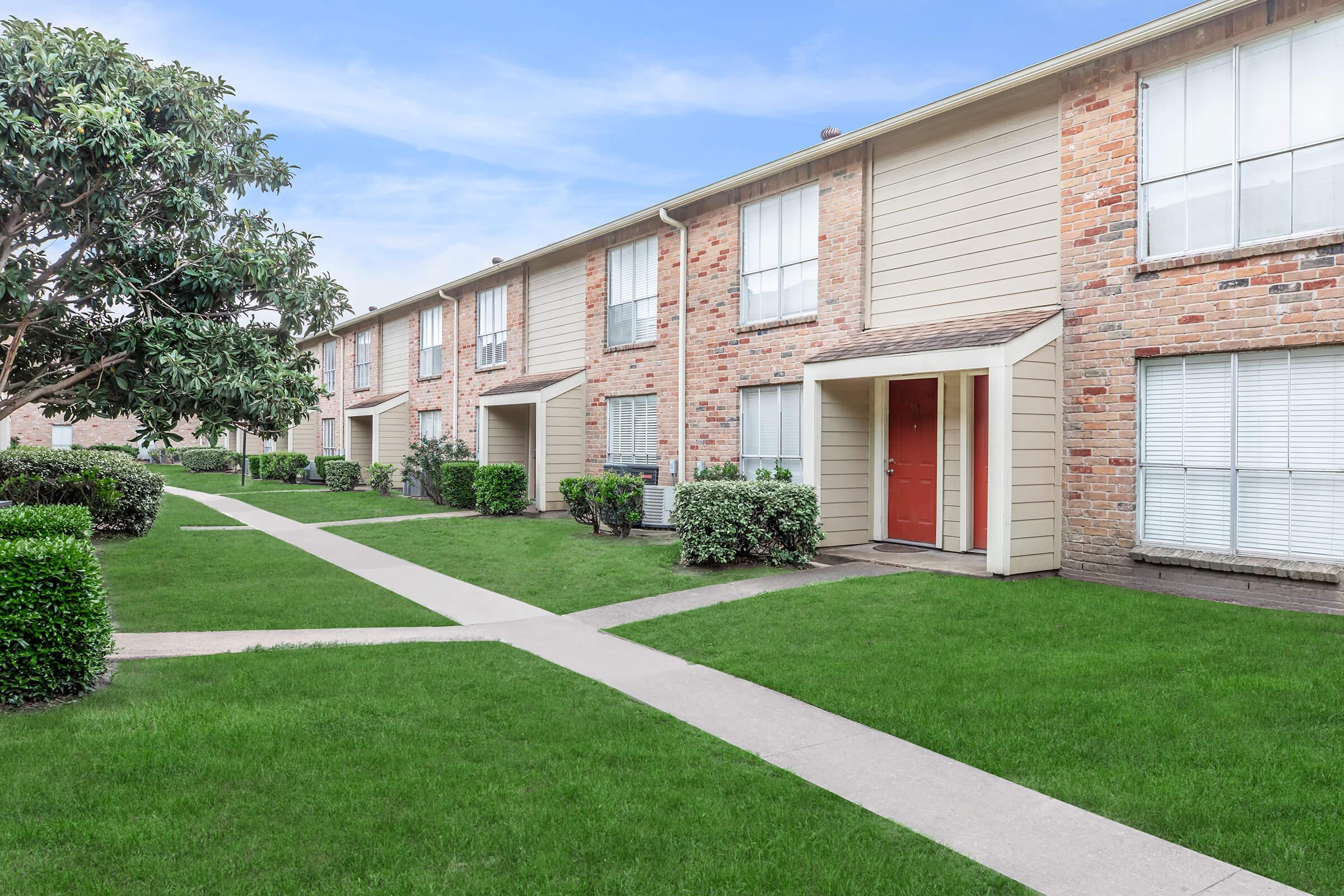 a large lawn in front of a house