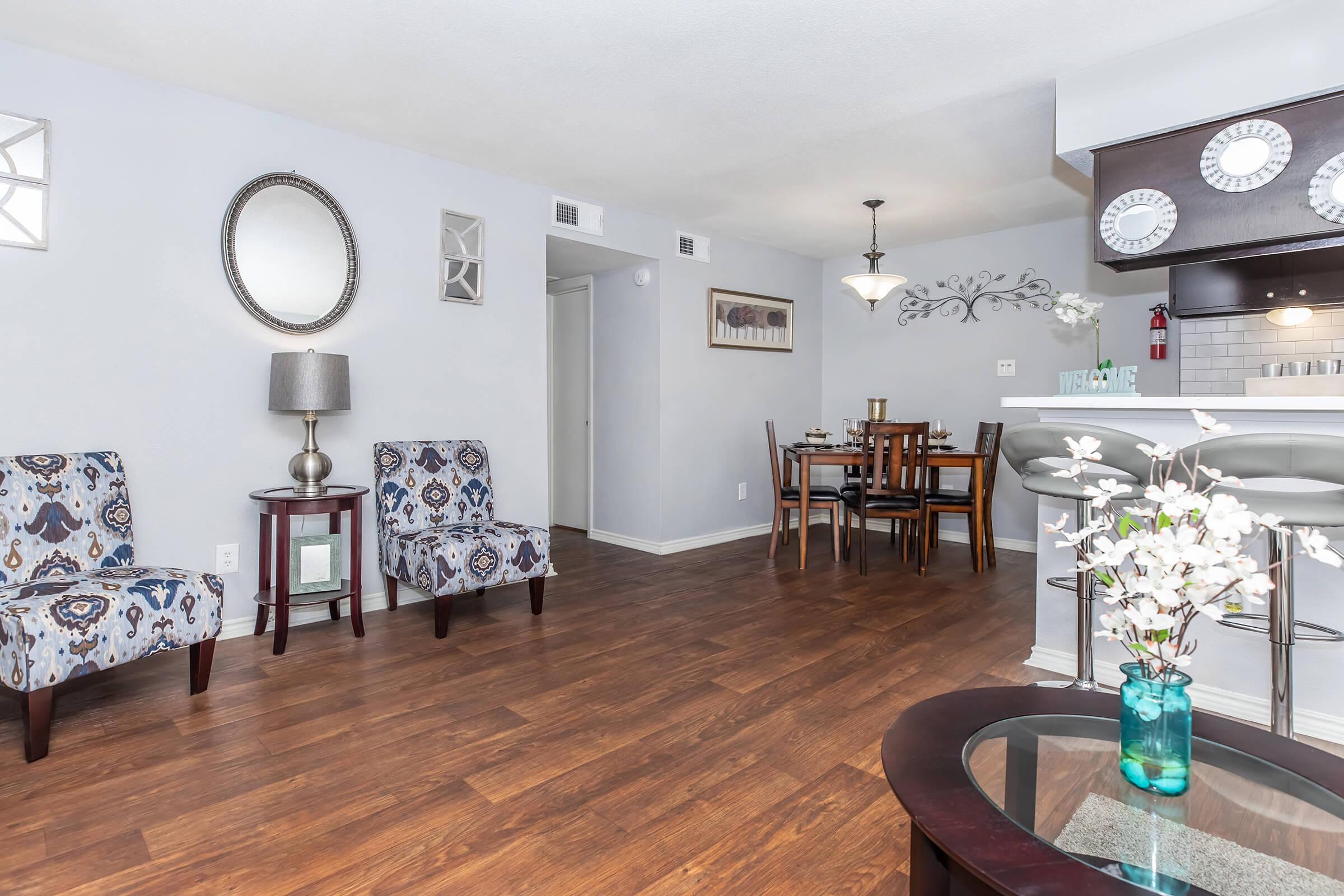 a living room filled with furniture and a lamp