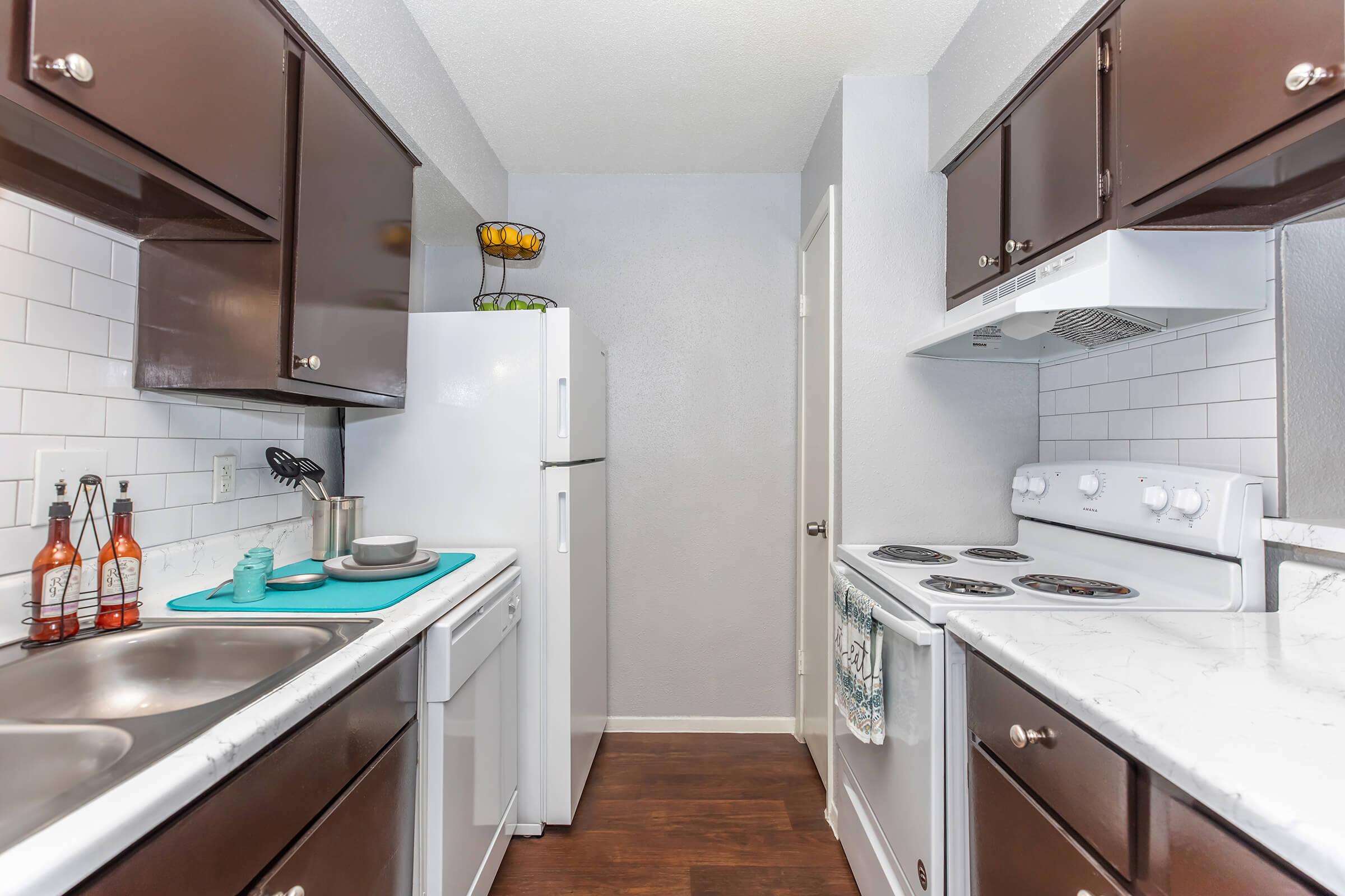 a kitchen with a stove and a sink