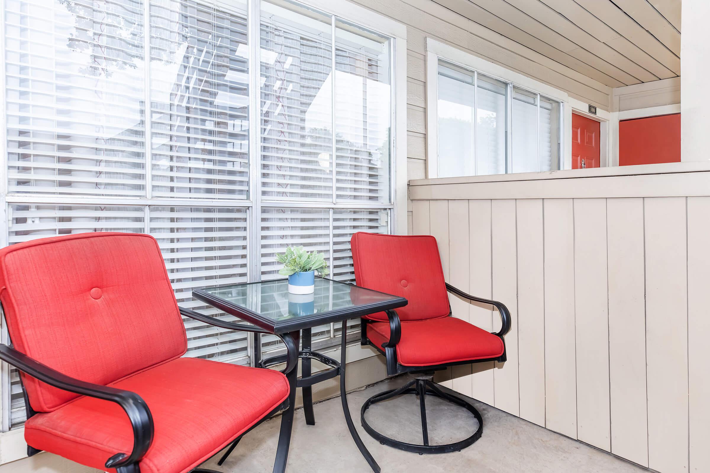 a chair sitting in front of a window