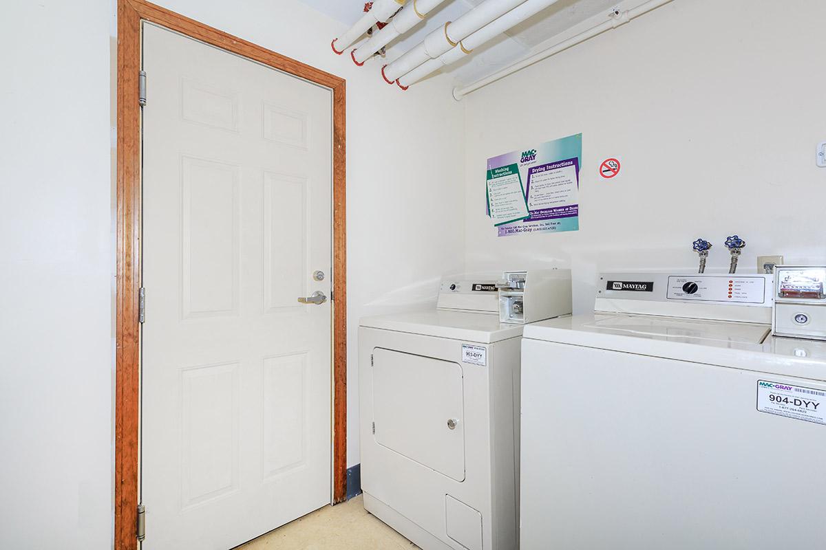 a white refrigerator freezer sitting in a room