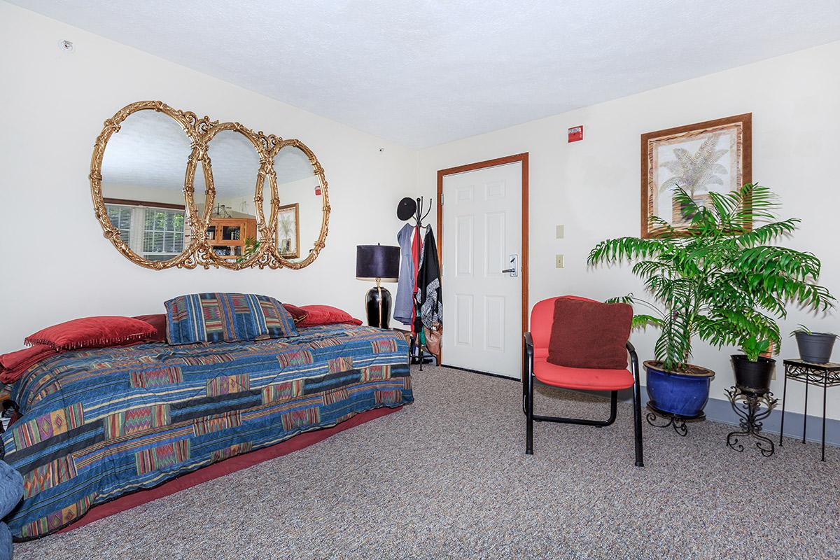 a large red chair in a room