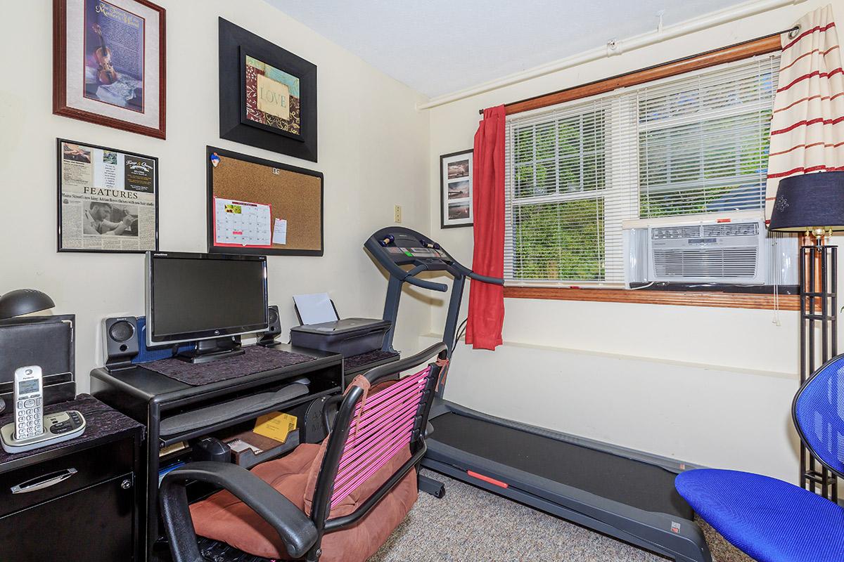 a room filled with furniture and a motorcycle