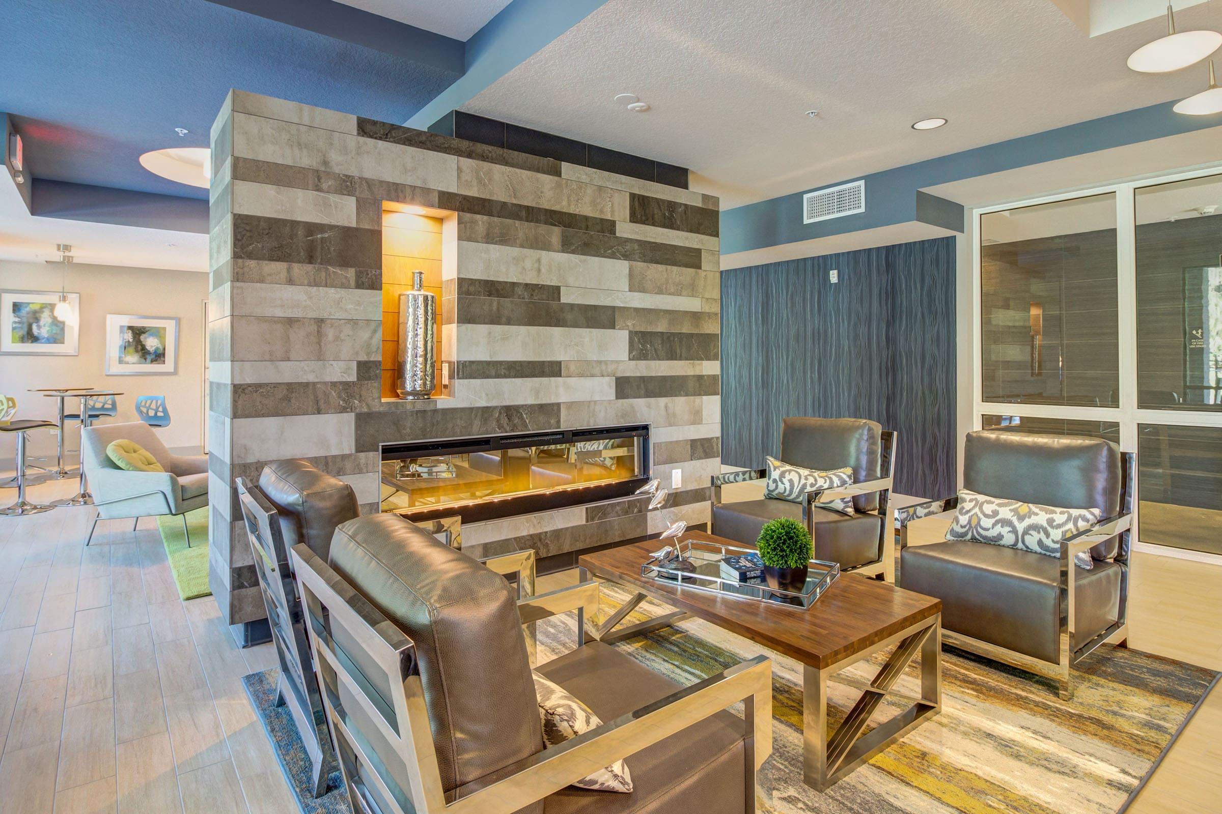 a living room filled with furniture and a fireplace