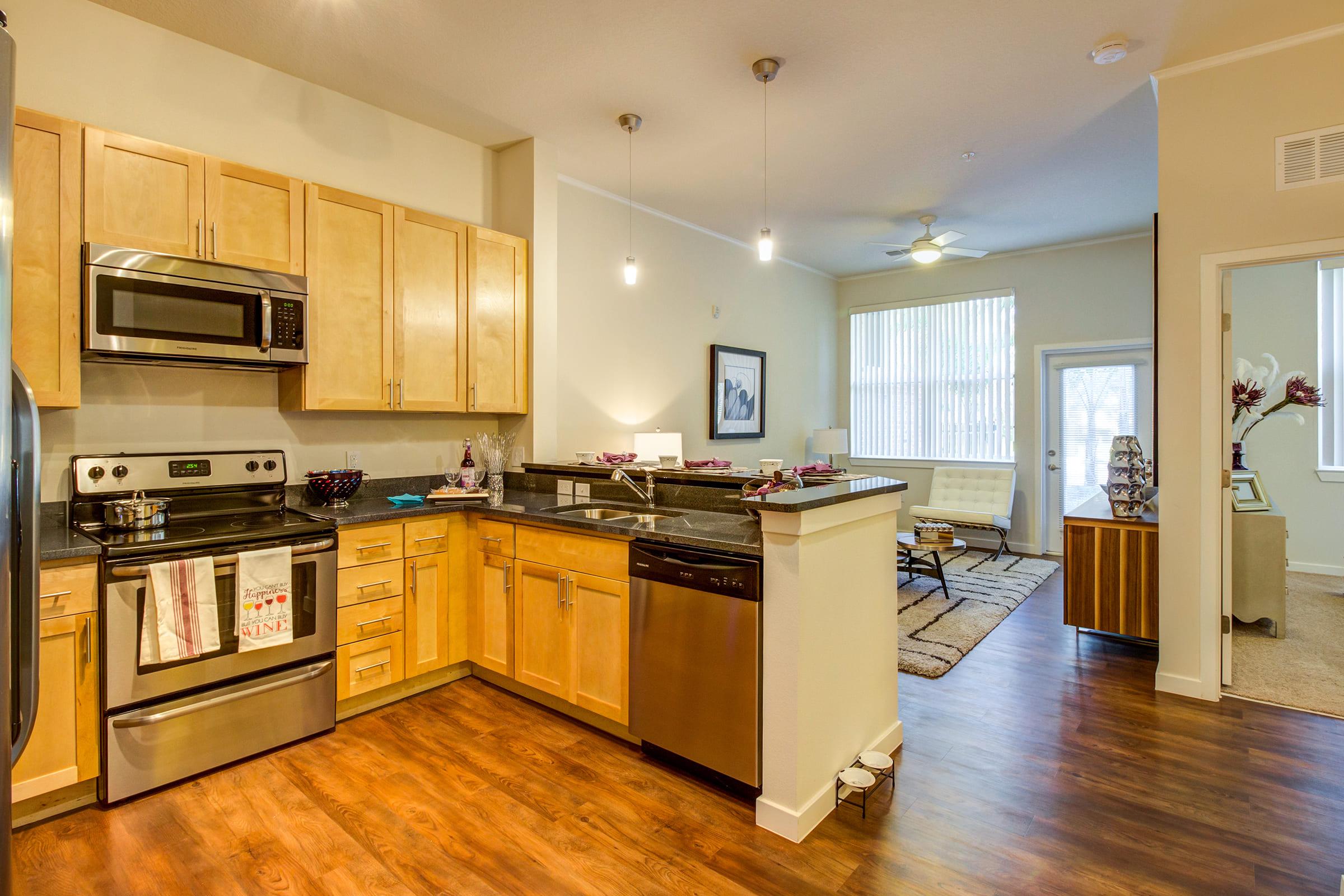 a large kitchen with stainless steel appliances