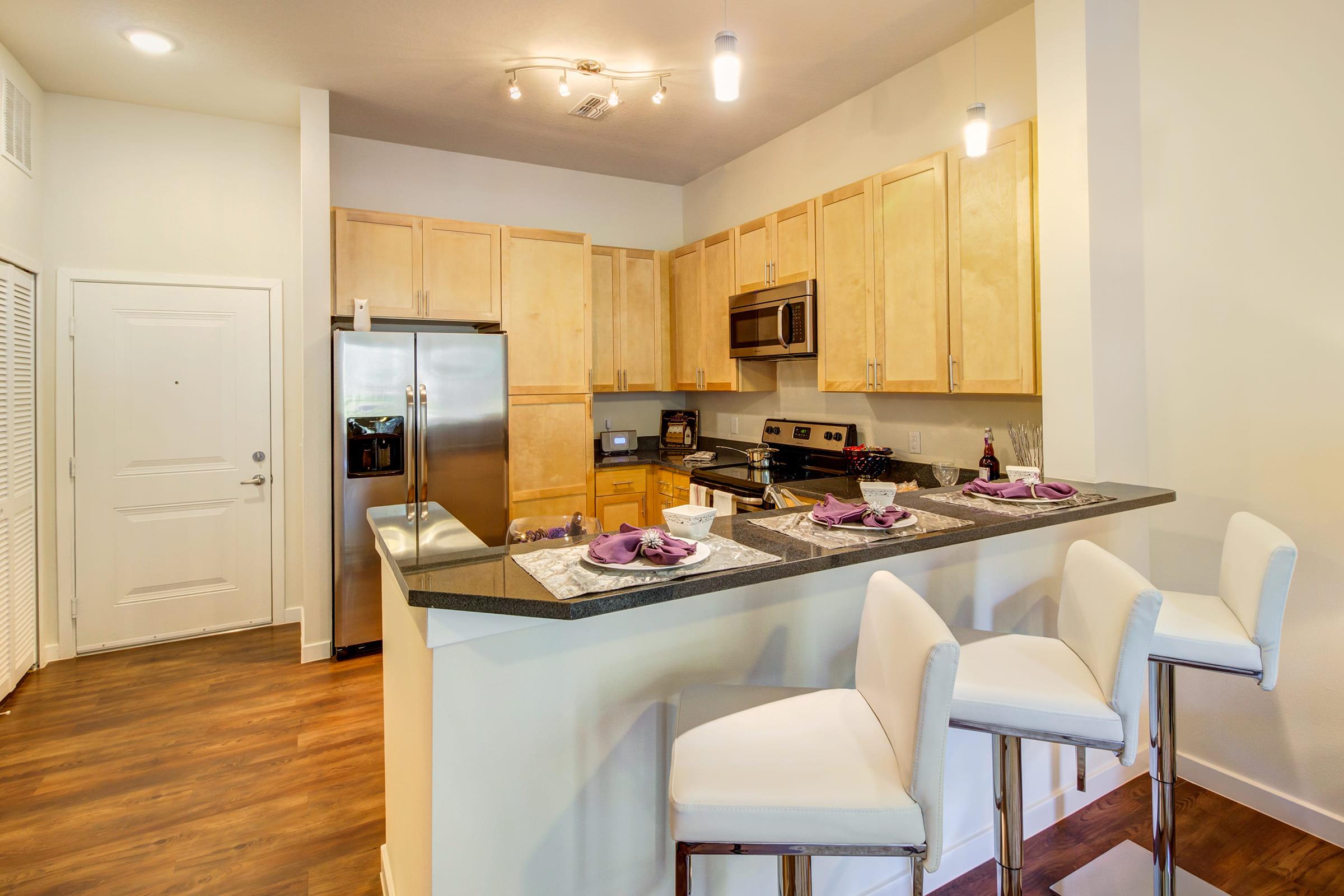 a kitchen with a dining table