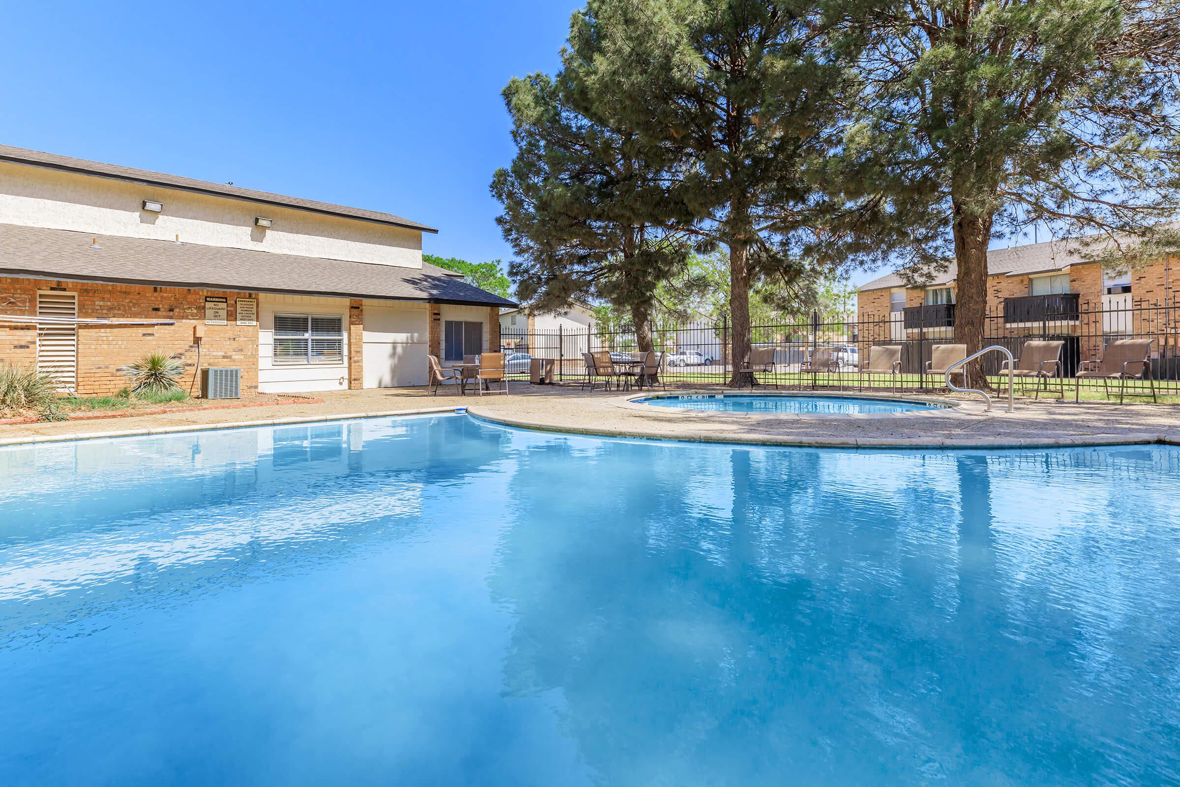 a large pool of water in front of a house