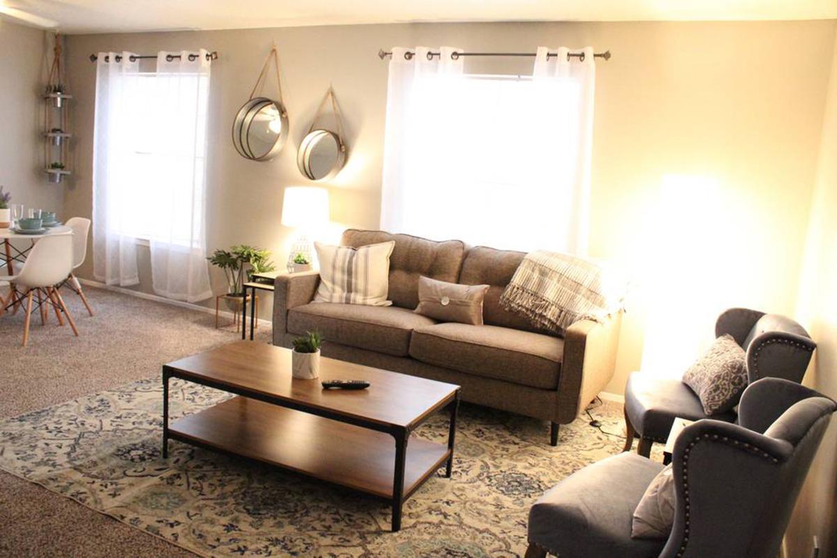 a living room filled with furniture and a fire place