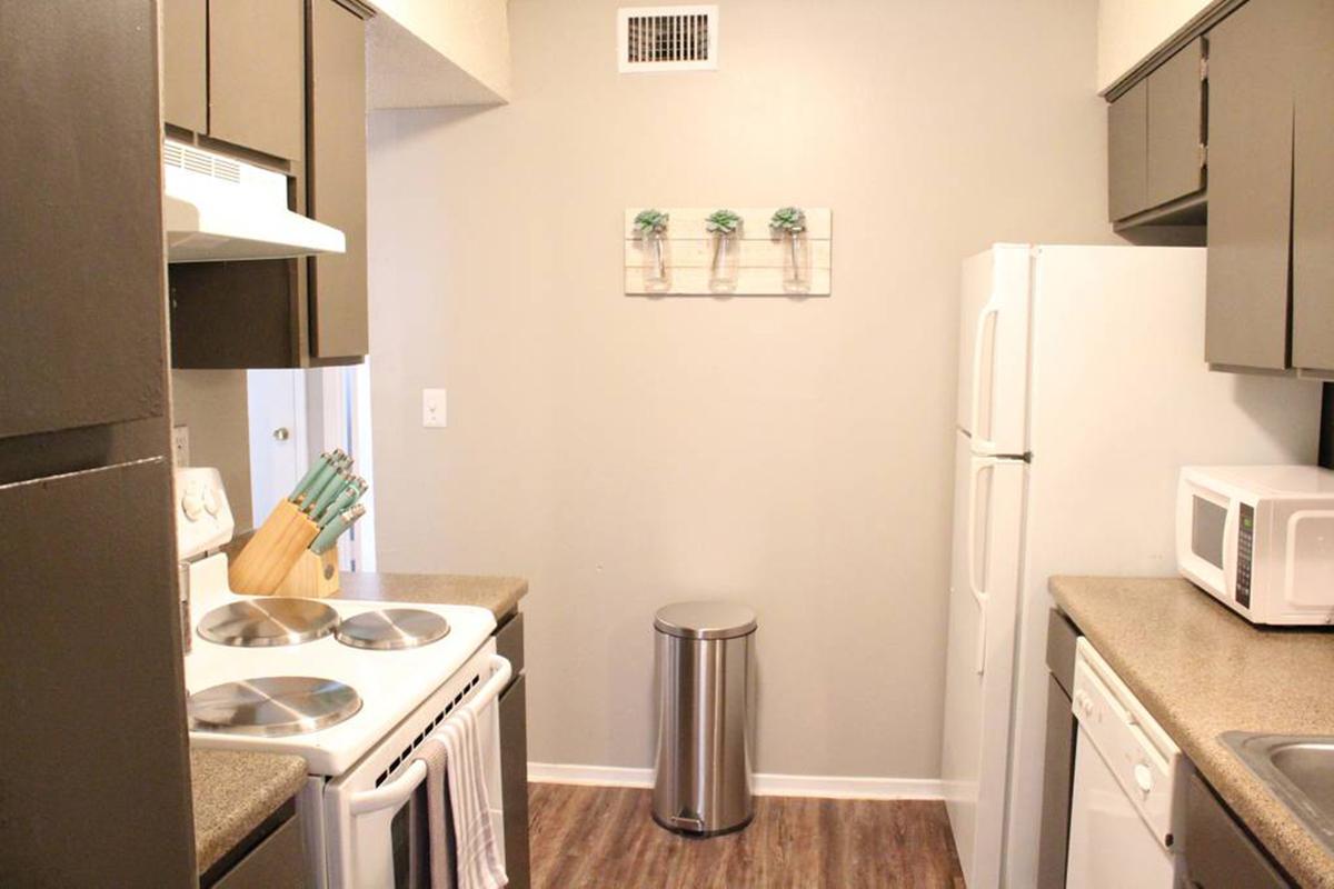 a kitchen with a sink and a microwave