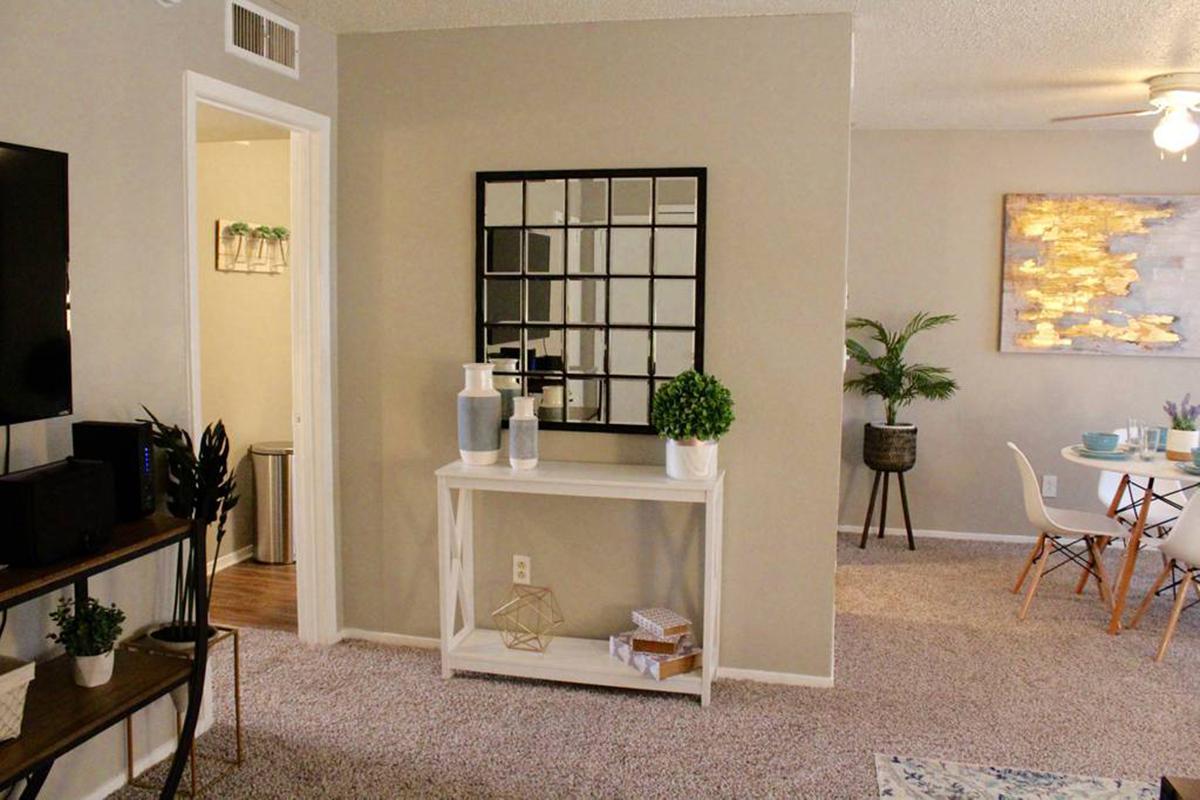 a living room filled with furniture and a fireplace