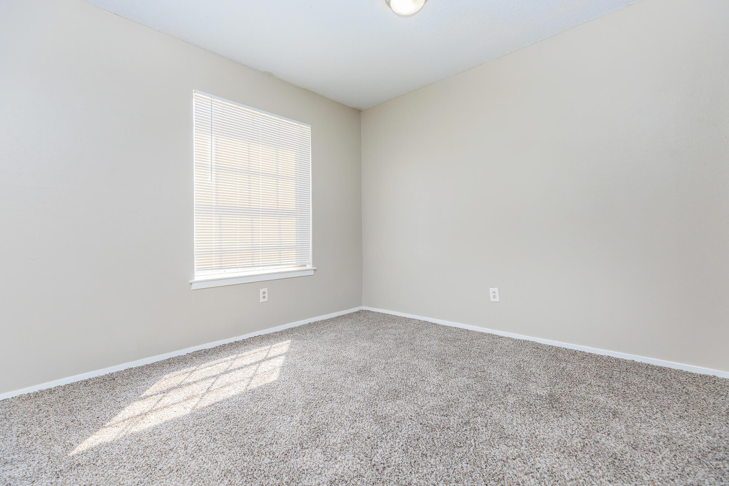 a bedroom with a large window