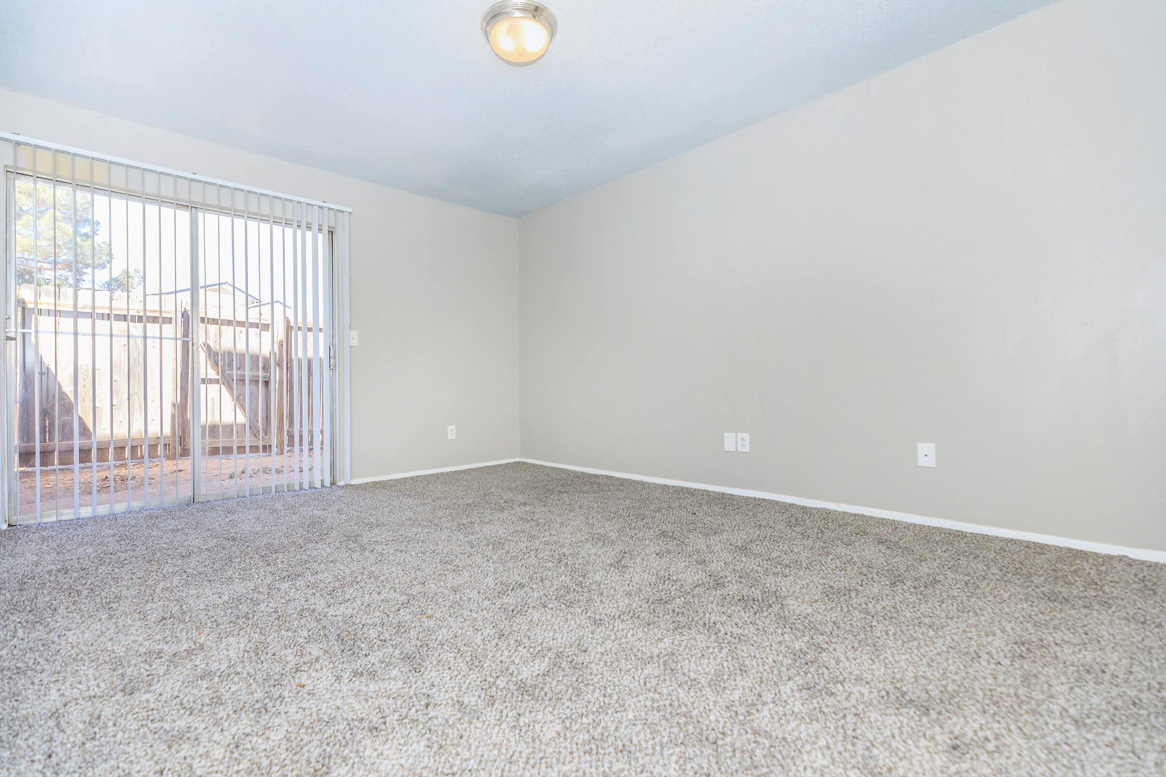 a bedroom with a large window