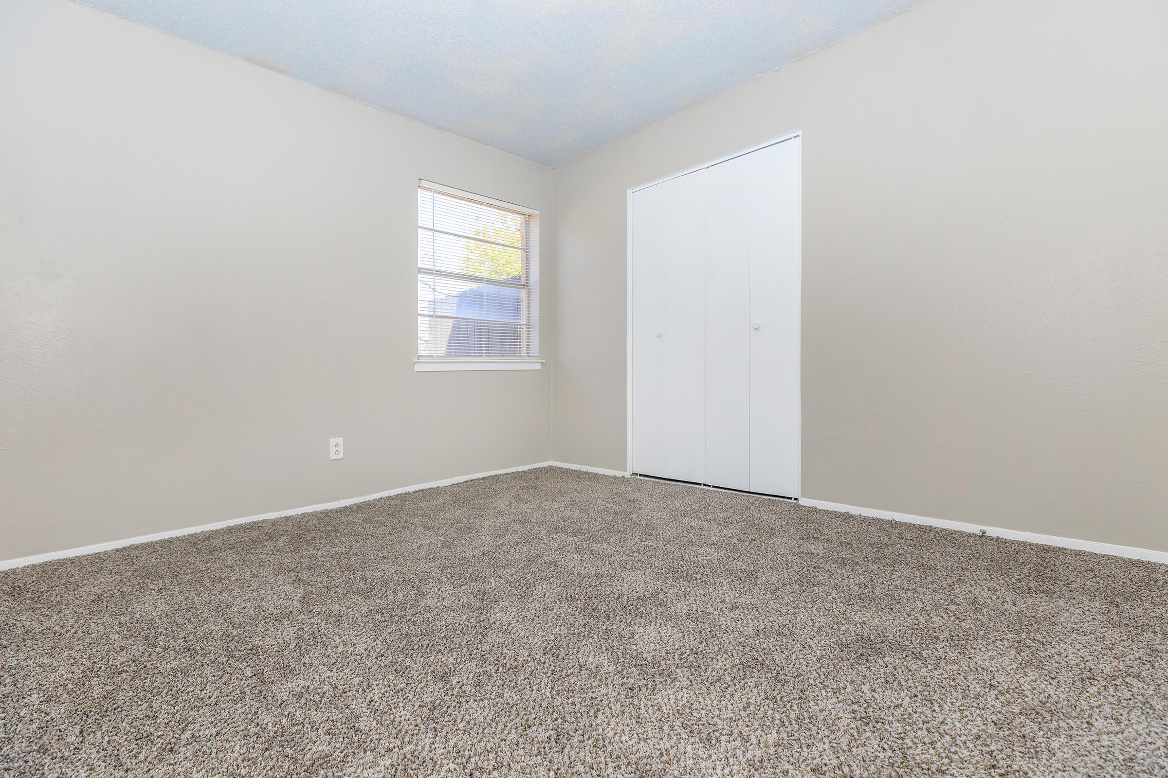 a bedroom with a large window