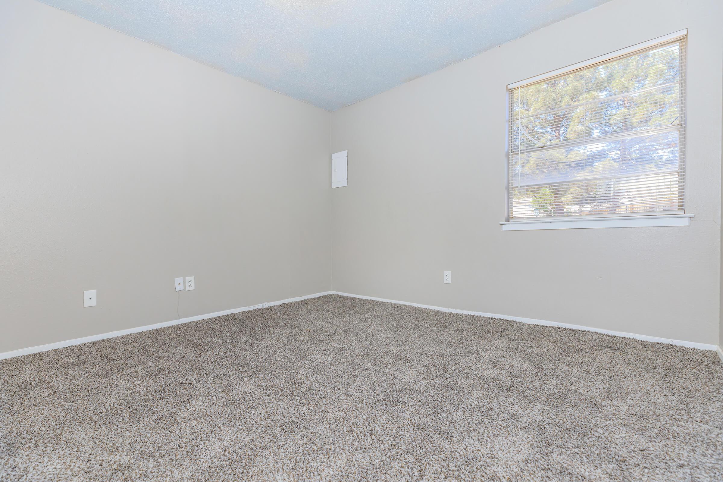 a bedroom with a large window