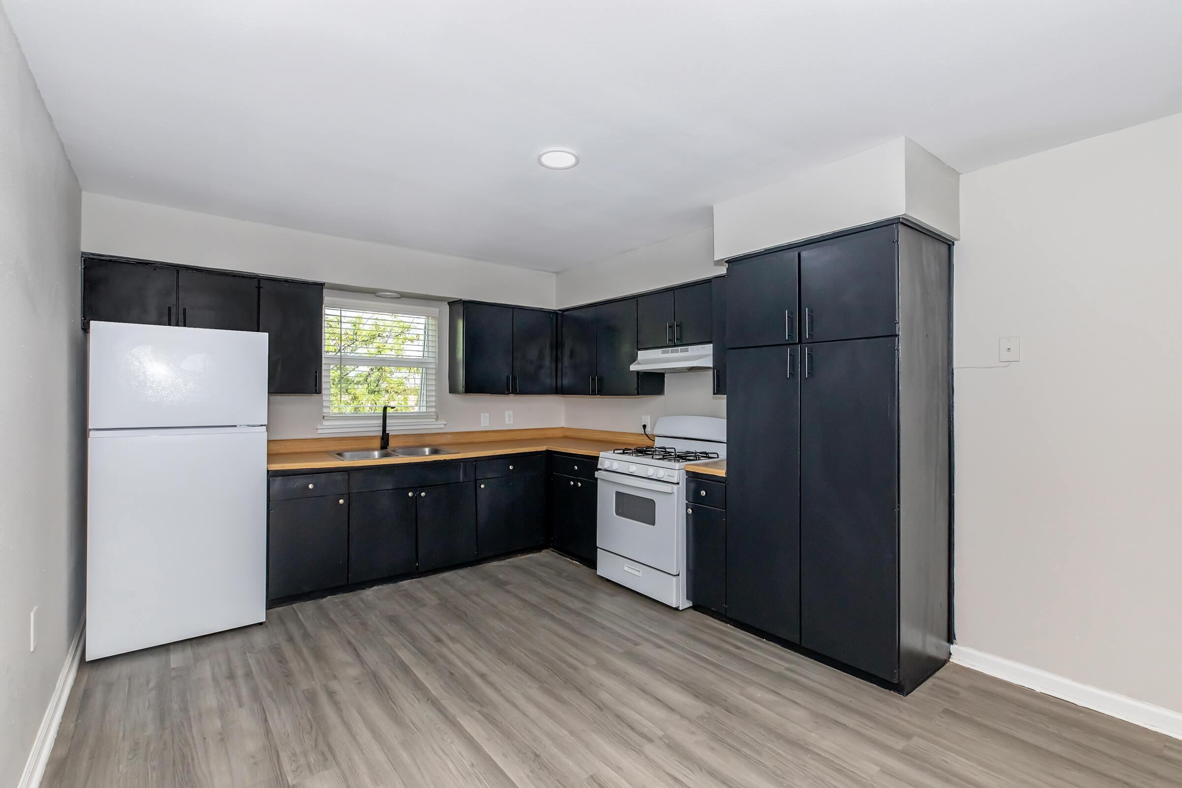 a kitchen with a tile floor