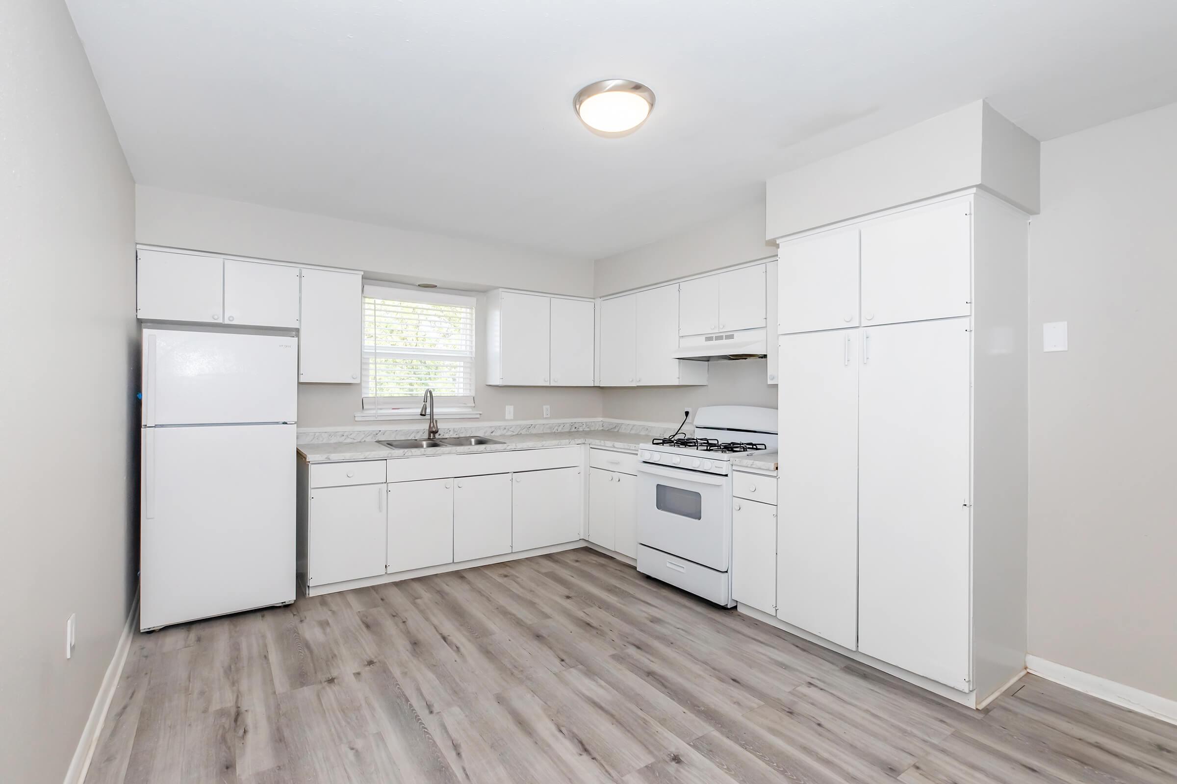 a kitchen with a wooden floor