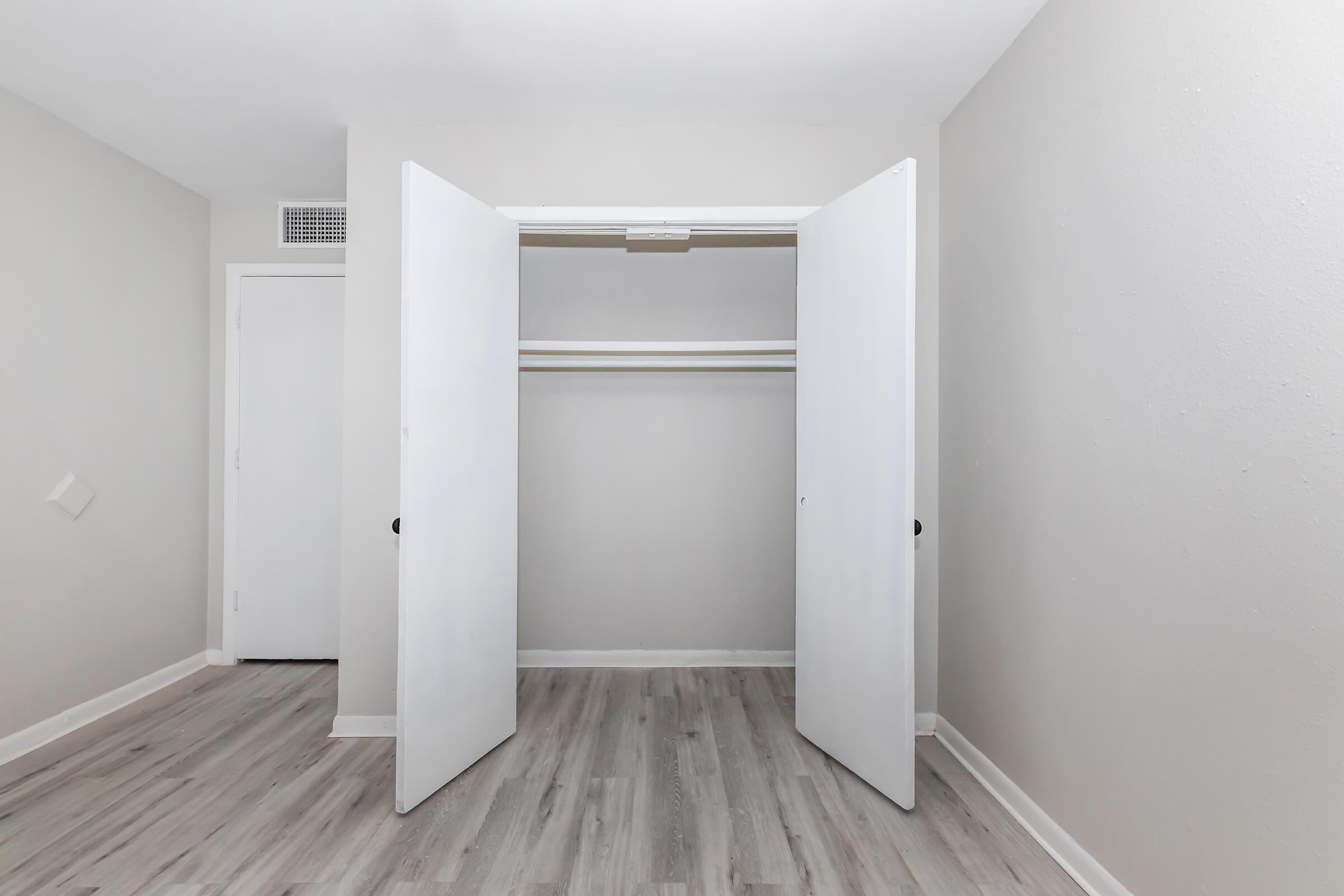 a large empty room with a wooden floor