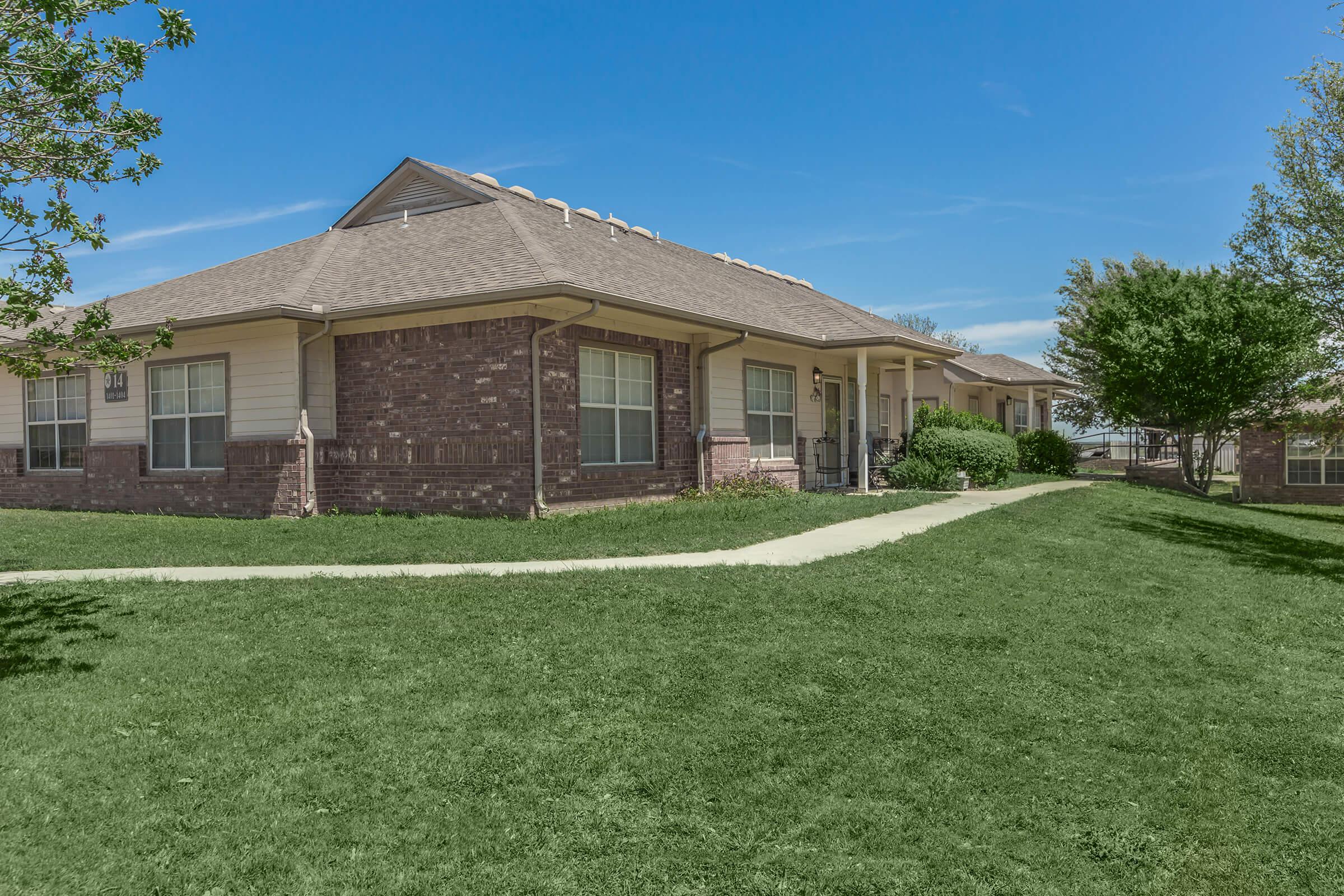 a large lawn in front of a house