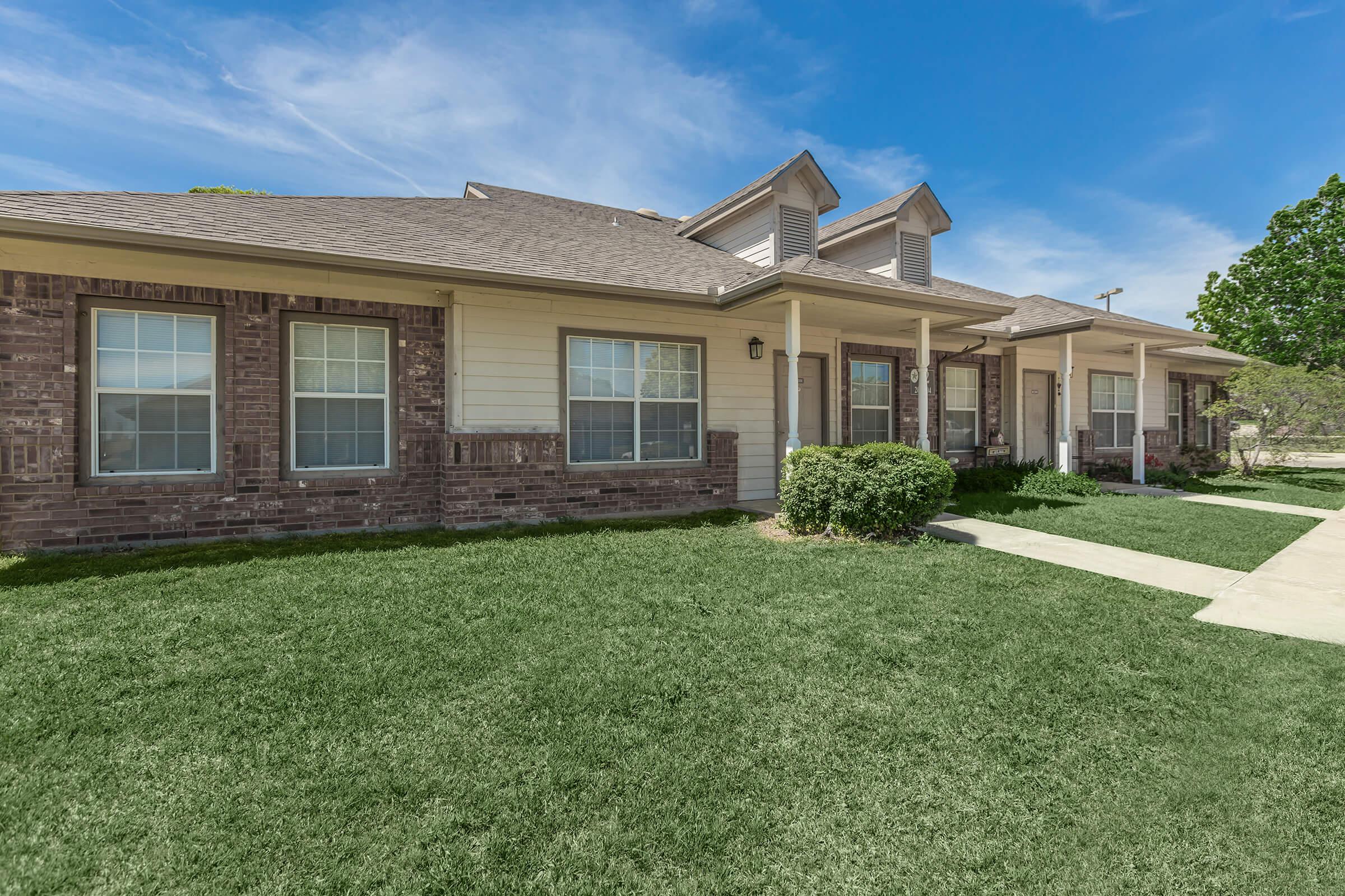 a large lawn in front of a house