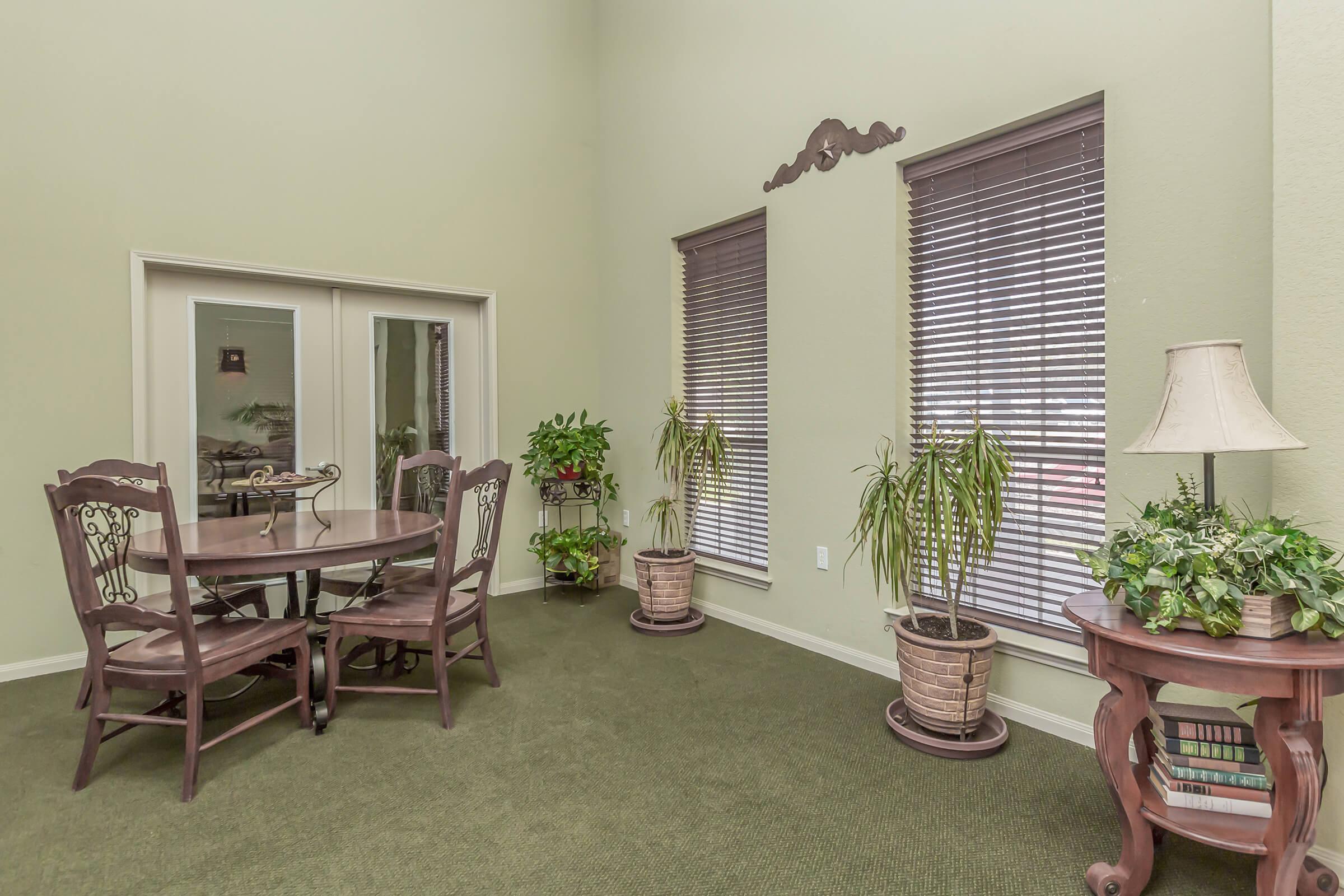 a living room filled with furniture and a table