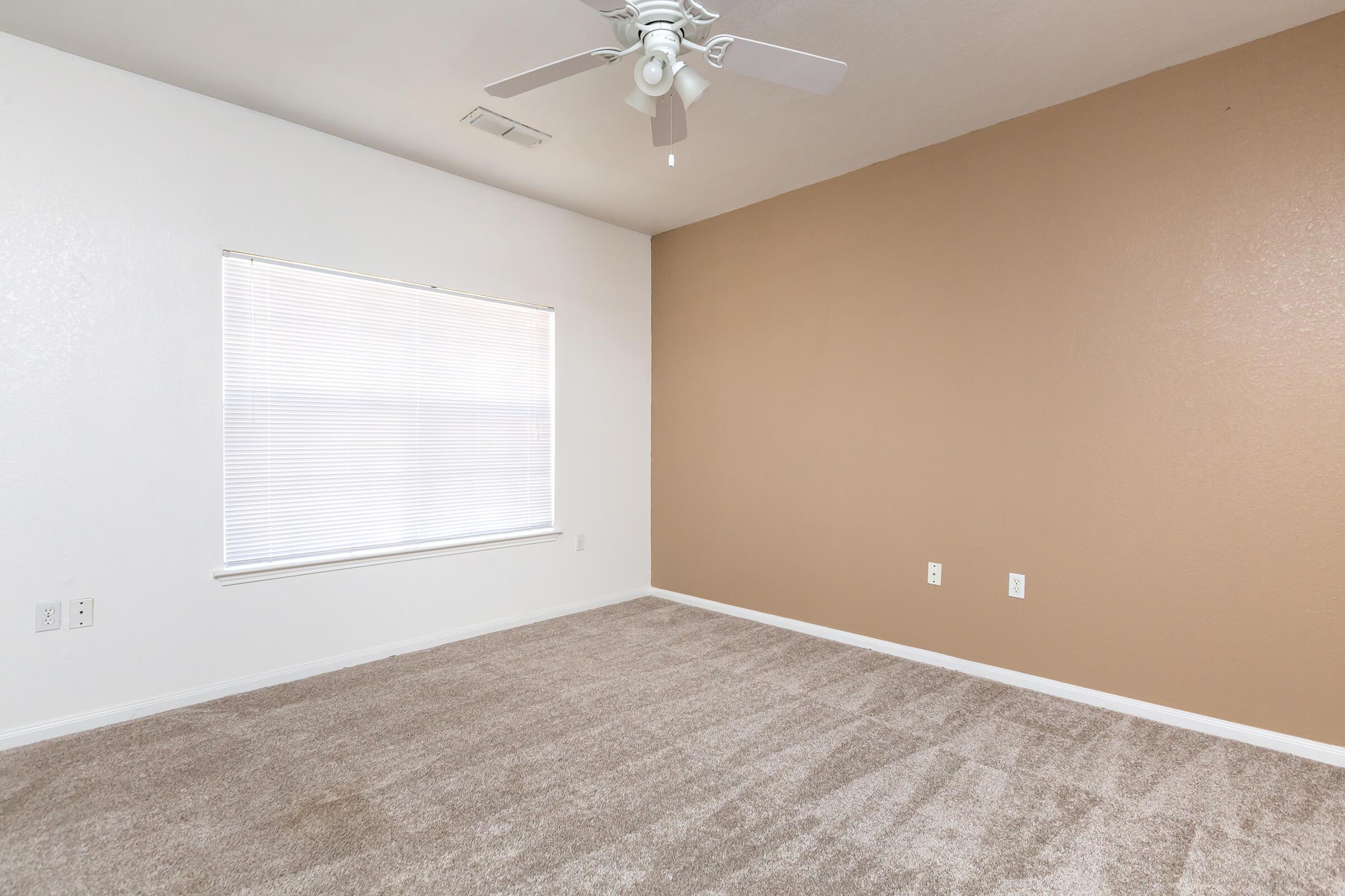 a bedroom with a large mirror