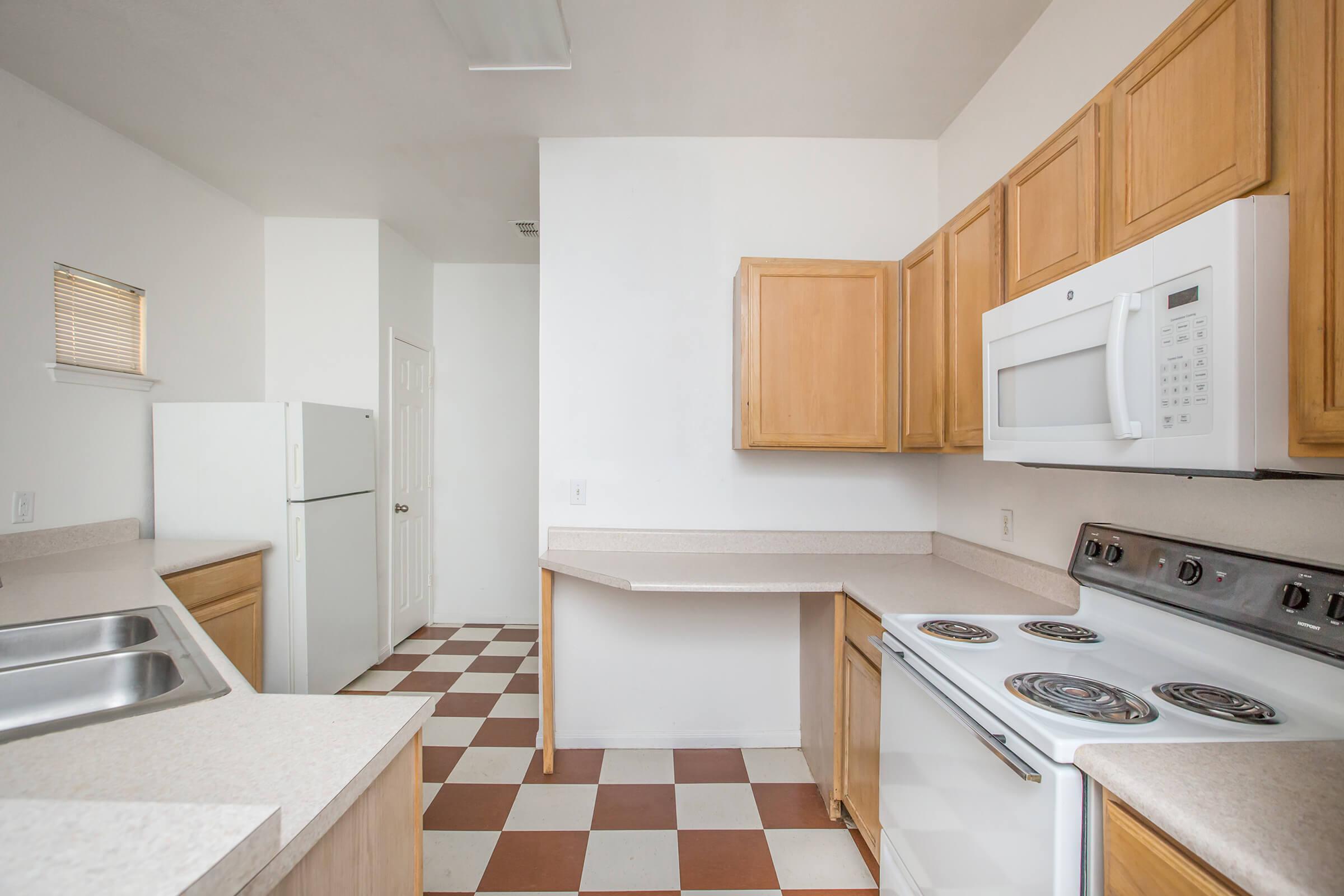 a kitchen with a stove top oven