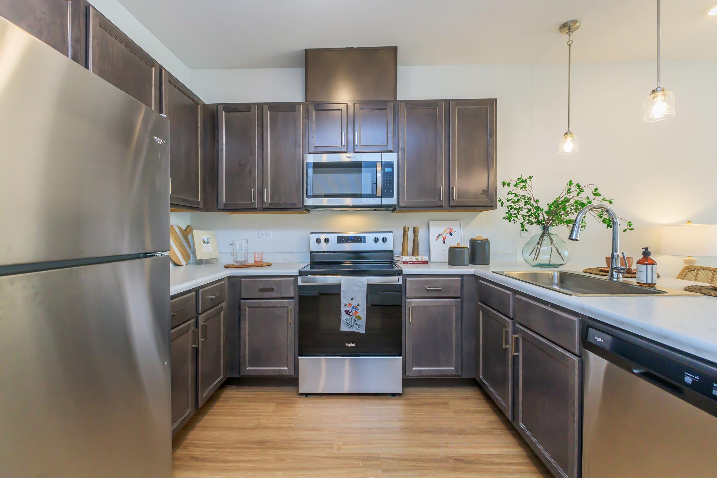 a modern kitchen with stainless steel appliances