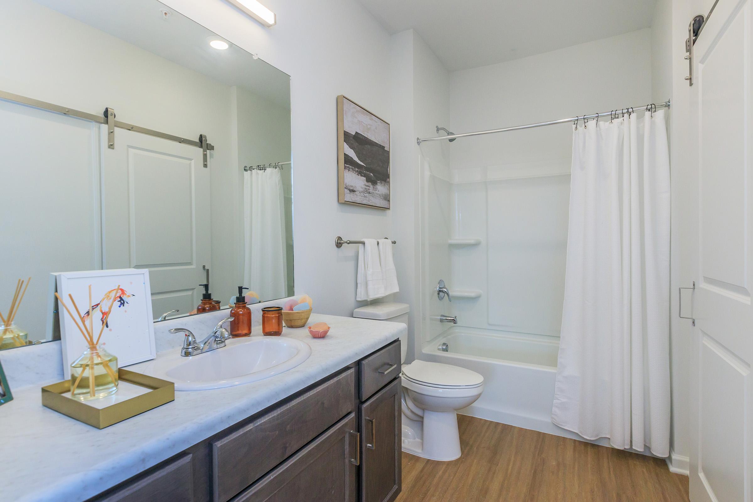 a kitchen with a sink and a mirror