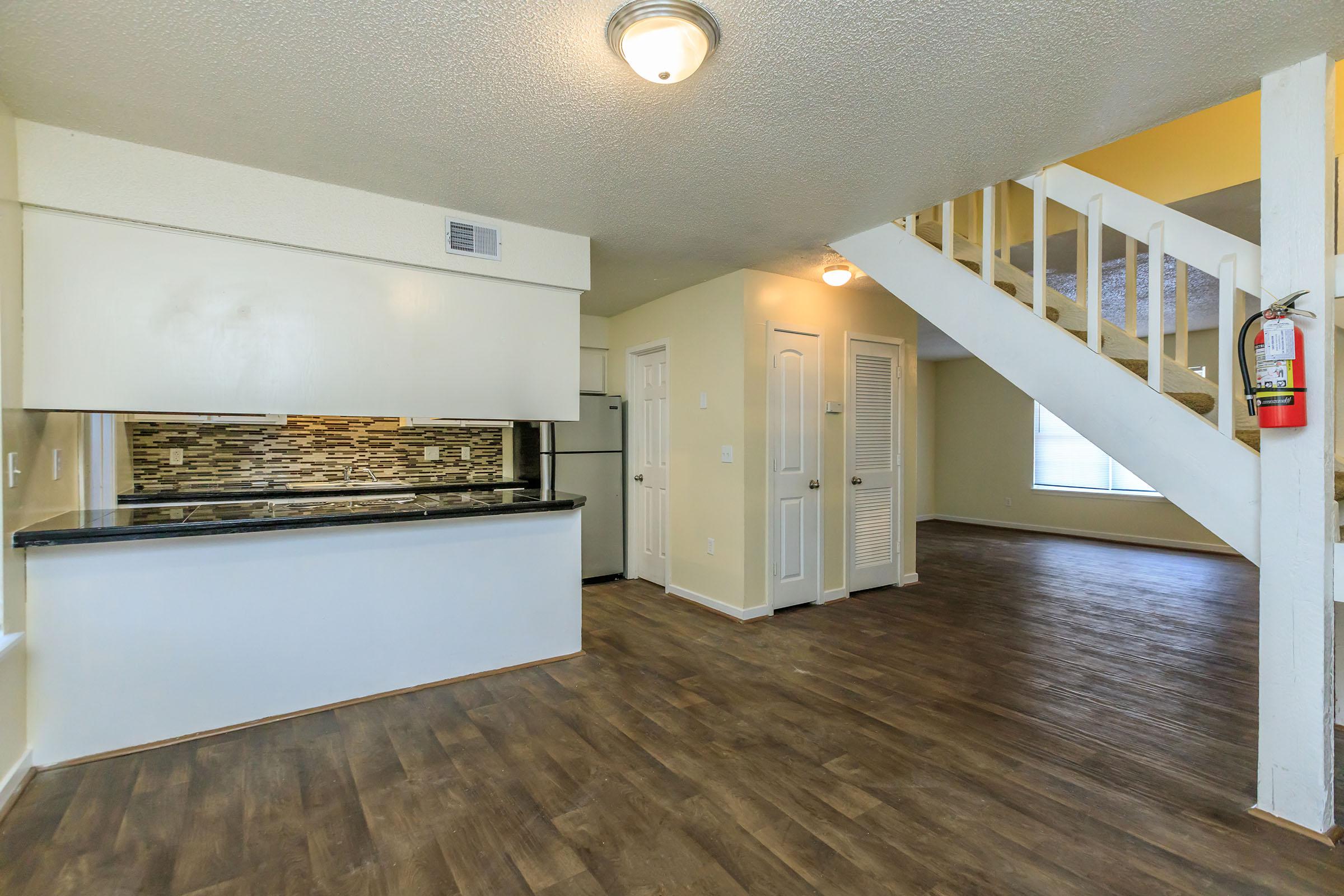 a kitchen with a wood floor