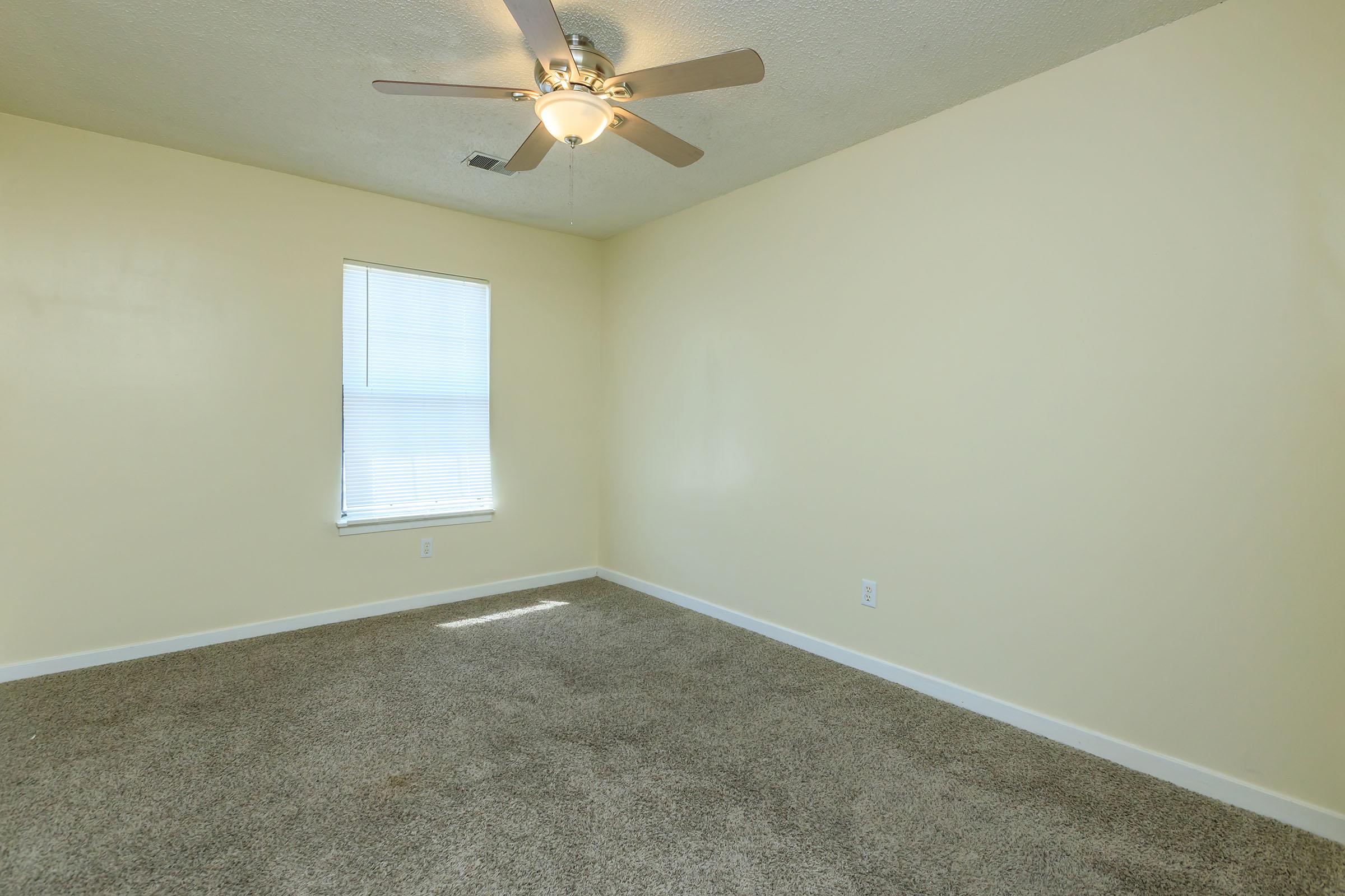 a bedroom with a large mirror